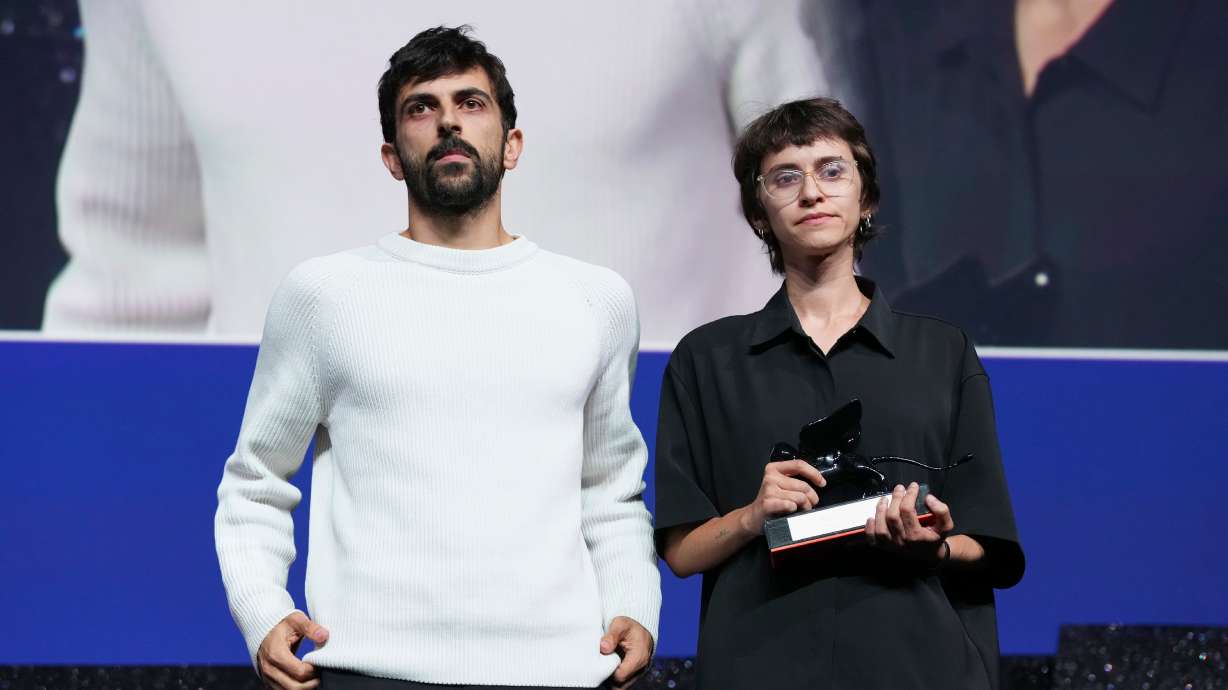 Directors Yuval Abraham, left, and Rachel Szor pose for photographers after accepting the special jury prize for the film 'NAZA' during the closing ceremony of the 83rd edition of the Venice Film Festival in Venice, Italy, on Saturday. An Israeli documentary about the civilian death toll in the war in Gaza has sparked fierce backlash at home after being awarded the special jury prize last week at the Venice Film Festival.