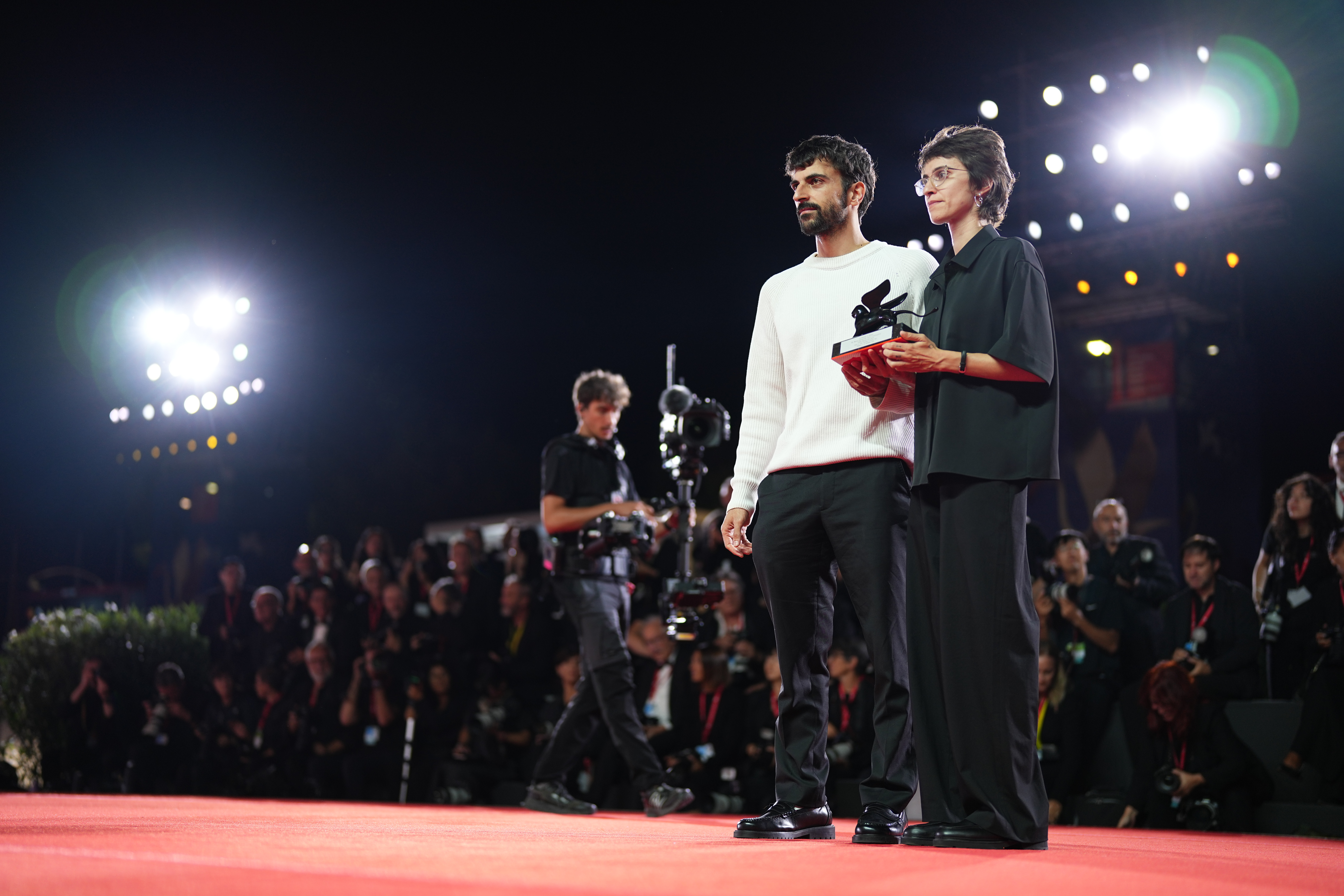 Directors Rachel Szor, left, and Yuval Abraham, winners of the special jury prize for the film 'NAZA', pose for photographers at the awards photo call during the closing ceremony of the 83rd edition of the Venice Film Festival in Venice, Italy, on Saturday.