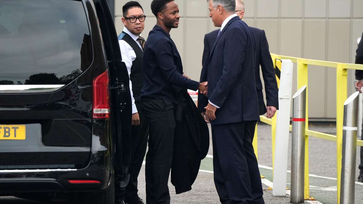 Former England soccer player Raheem Sterling, second left, arrives at Basingstoke Magistrates' Court ahead of his first appearance accused of dangerous driving in Hampshire, England, Tuesday, Sept. 15, 2026.