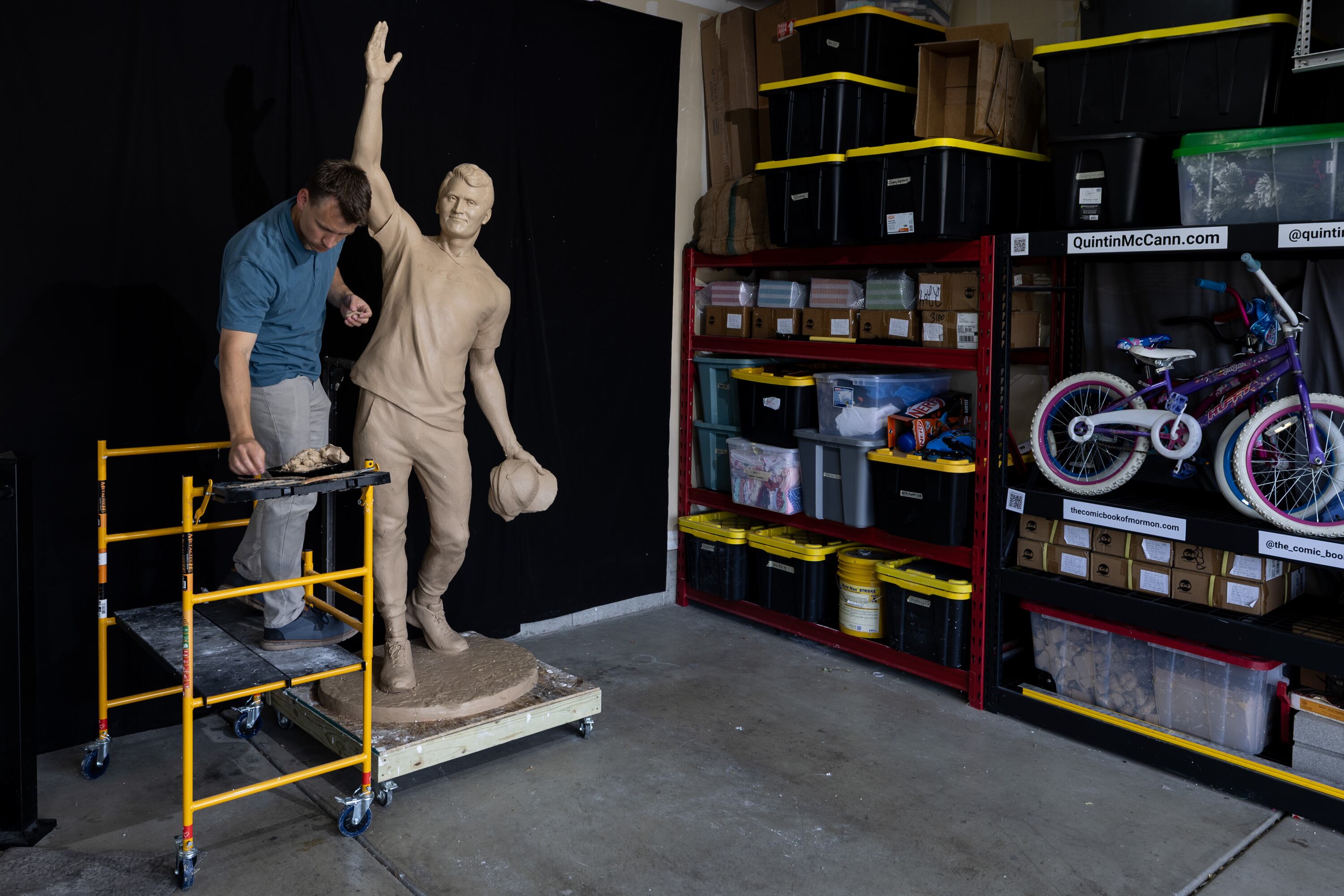 Quintin McCann works on his original clay mold of Charlie Kirk, fixing it at his home in Eagle Mountain after the bronze molding process damaged it on Monday. McCann is a longtime listener of Kirk.