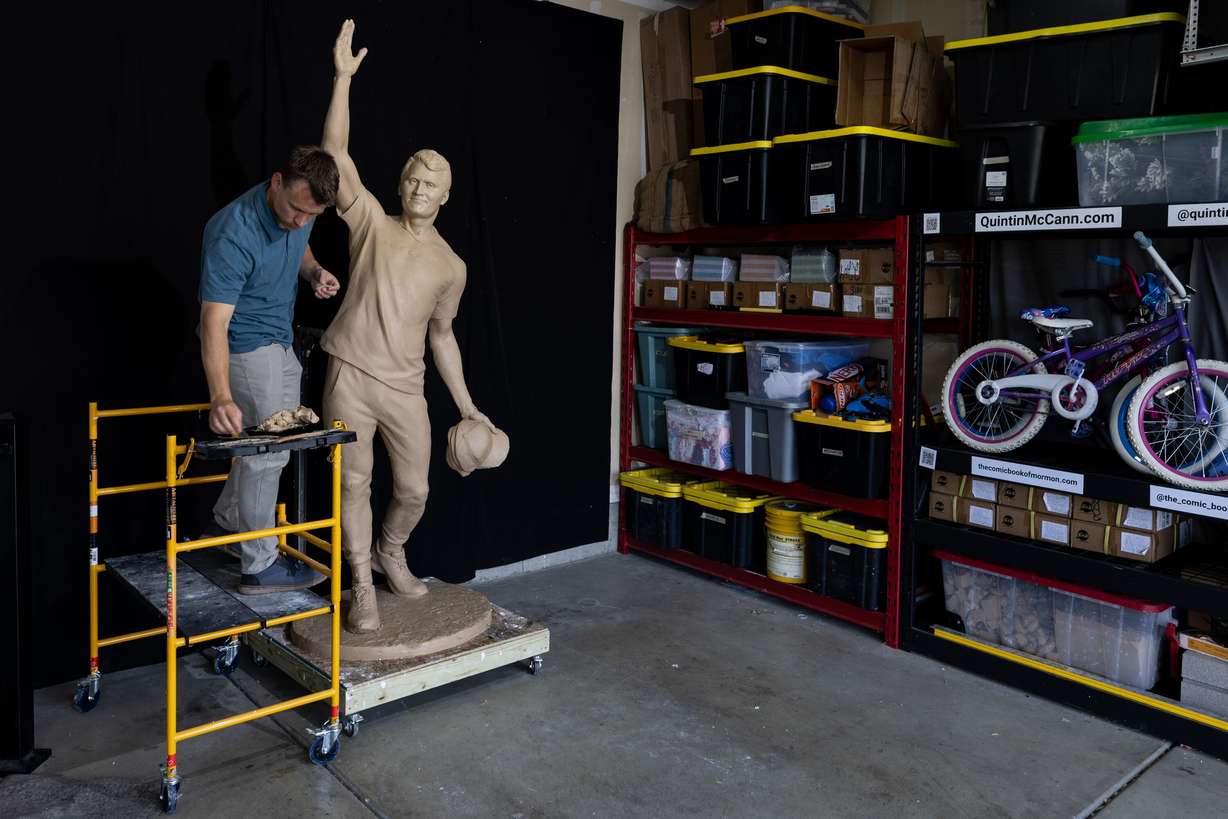 Quintin McCann works on his original clay mold of Charlie Kirk, fixing it at his home in Eagle Mountain after the bronze molding process damaged it on Monday. McCann is a longtime listener of Kirk.