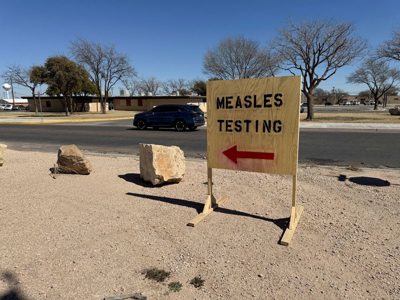 FILE PHOTO: A sign reading "measles testing" is seen as an outbreak in Gaines County, Texas, has raised concerns over its spread to other parts of the state, in Seminole, Texas, U.S., February 25, 2025.