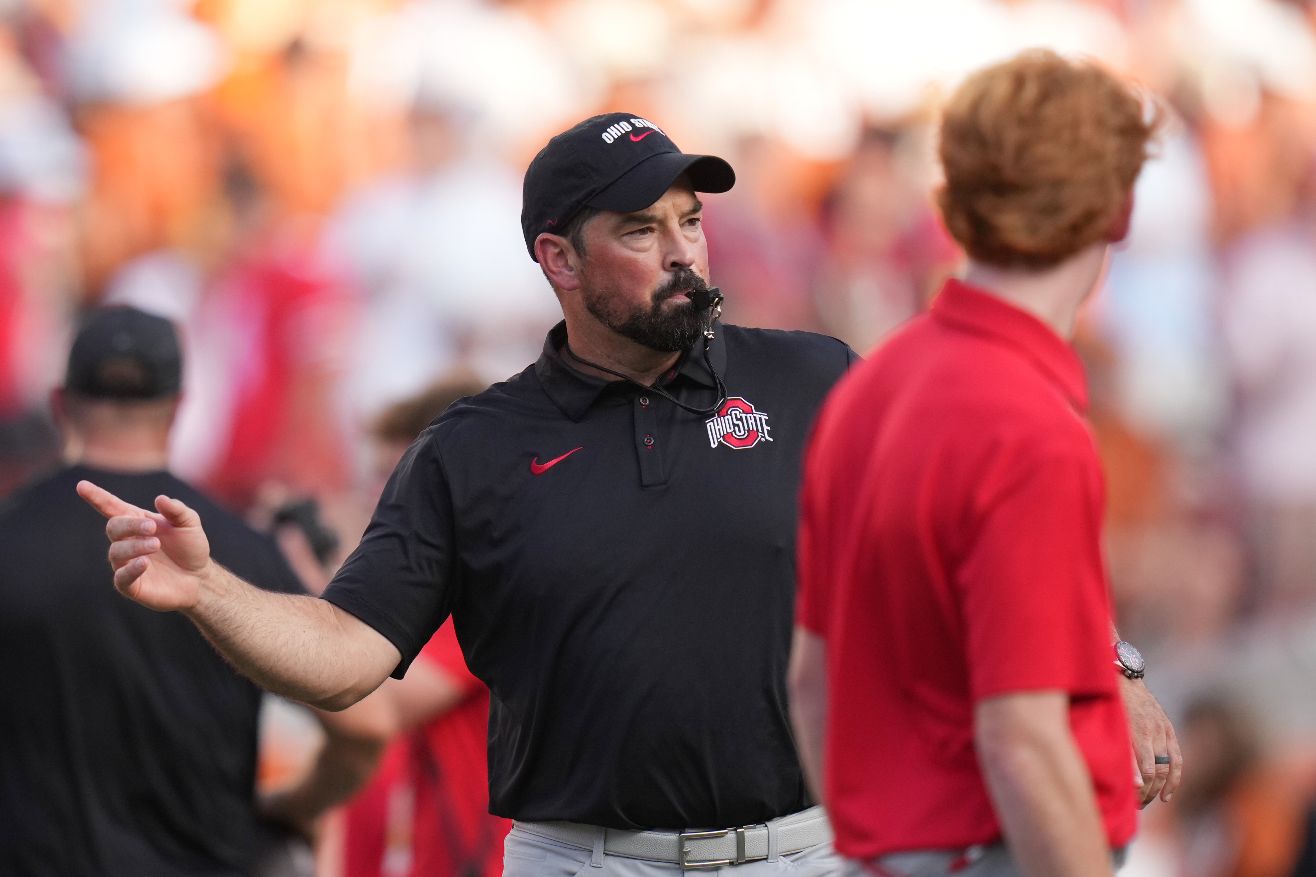 Ohio State head coach Ryan Day watches players warm up before an NCAA college football game against Texas in Austin, Texas, Saturday, Sept. 12, 2026. 
