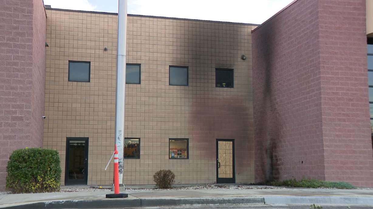 American Preparatory Academy after one person died when a vehicle struck the building and caught fire on Monday.