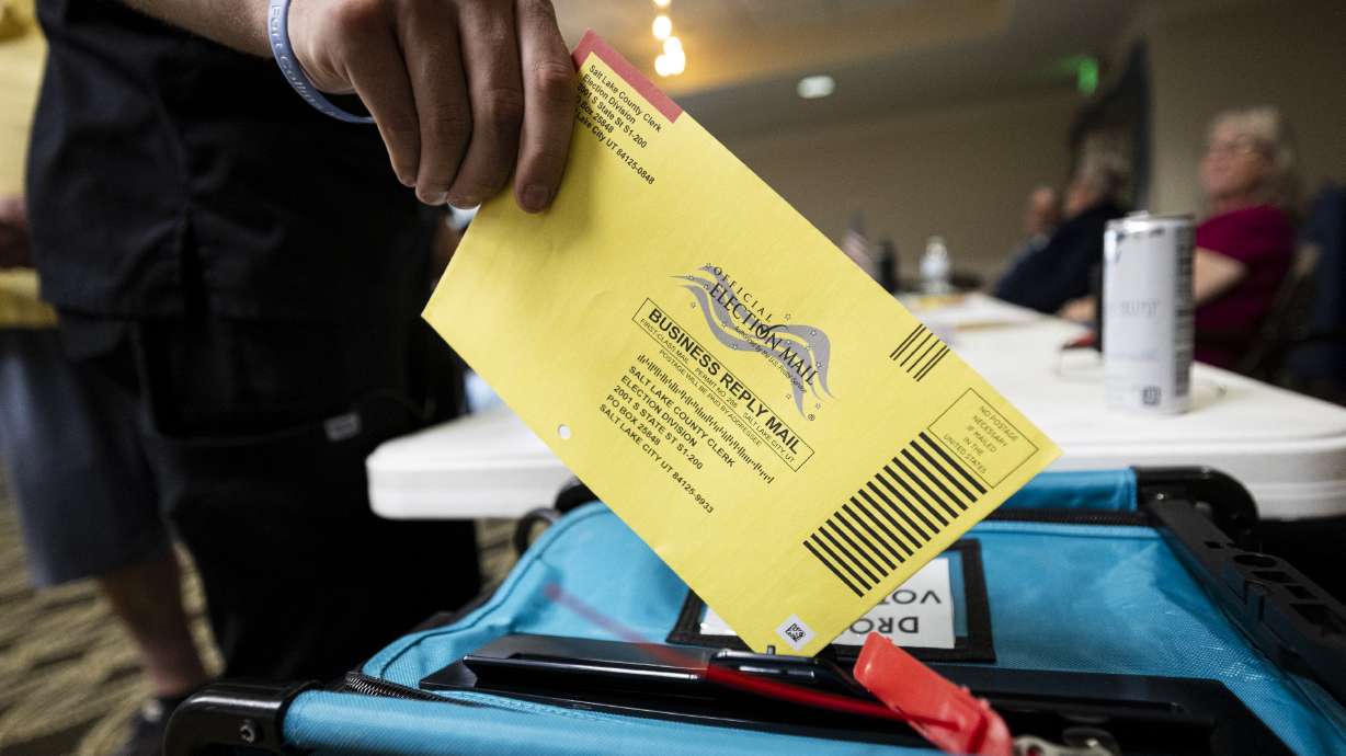 A voter drops in their completed ballot into a drop box during Utah’s primary election at Legacy Village of Provo on June 23. A legislative audit found that state and local officials have taken steps to improve election administration, but several repeated "minor" errors should be addressed.