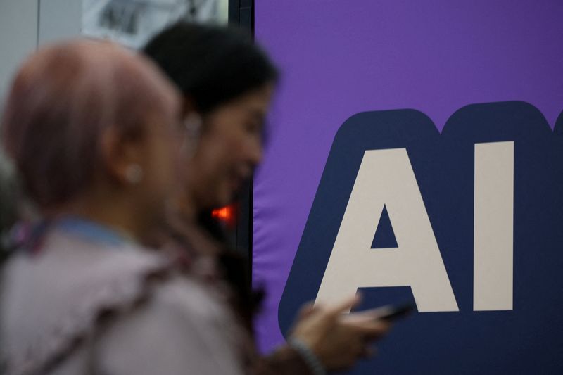 FILE PHOTO: A banner shows message reading "AI" during the London Tech Week at Olympia, in London, Britain, June 8, 2026.