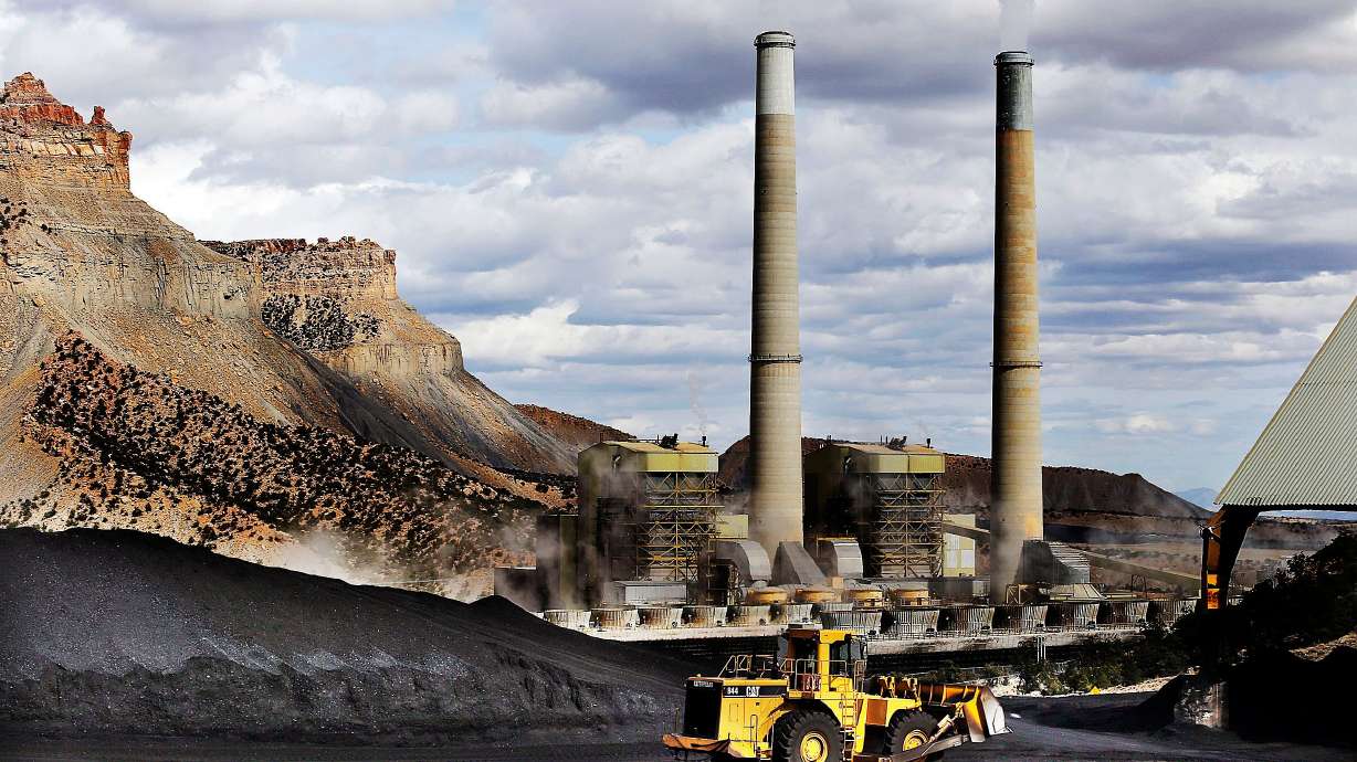 A loader moves coal at the Huntington power plant in Huntington, March 24, 2015. Utah politicians are divided on the future of power plants after the Trump administration repealed emissions rules related to them.