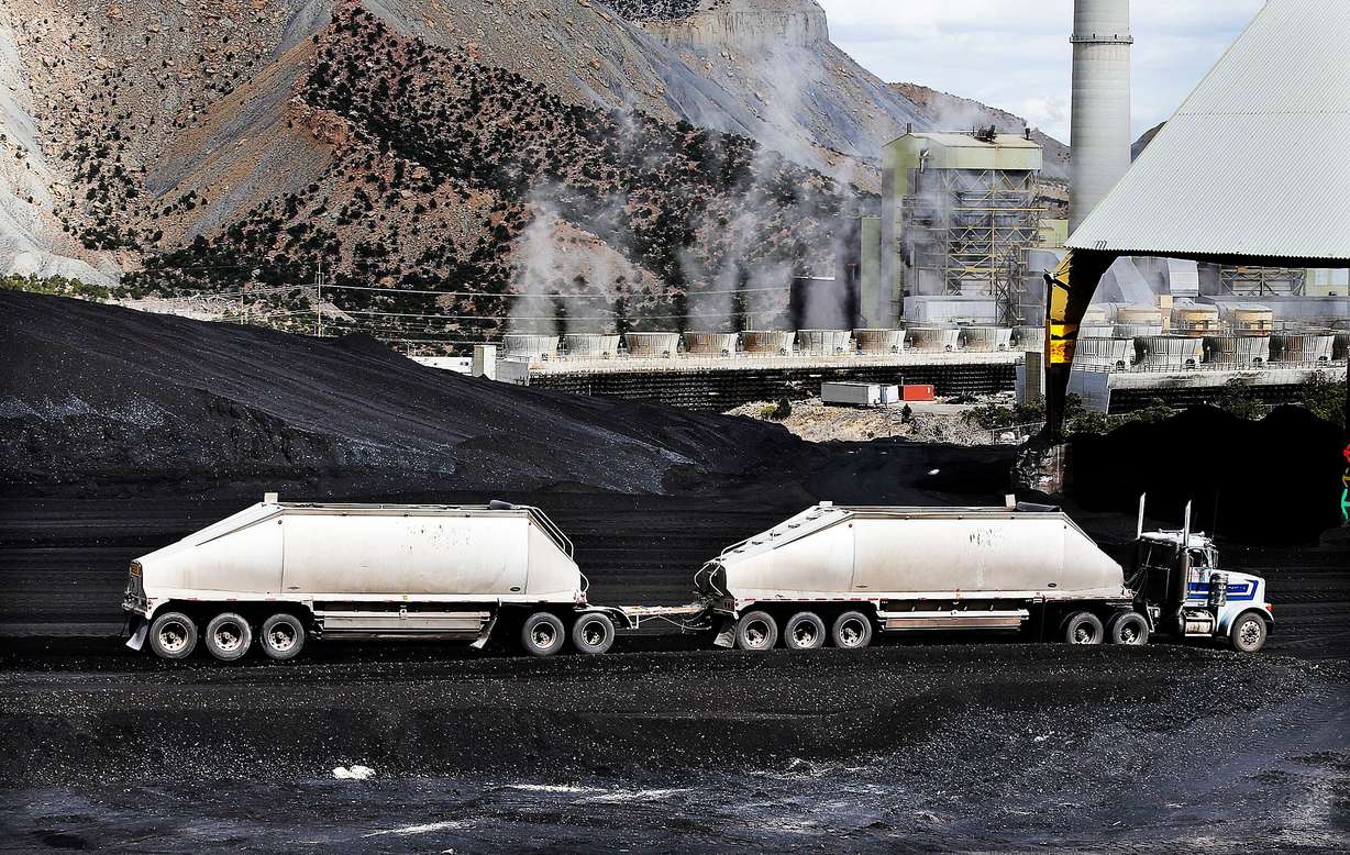A truck dumps coal at the Huntington power plant in Huntington, March 24, 2015. The plant is now scheduled to operate until at least 2045.