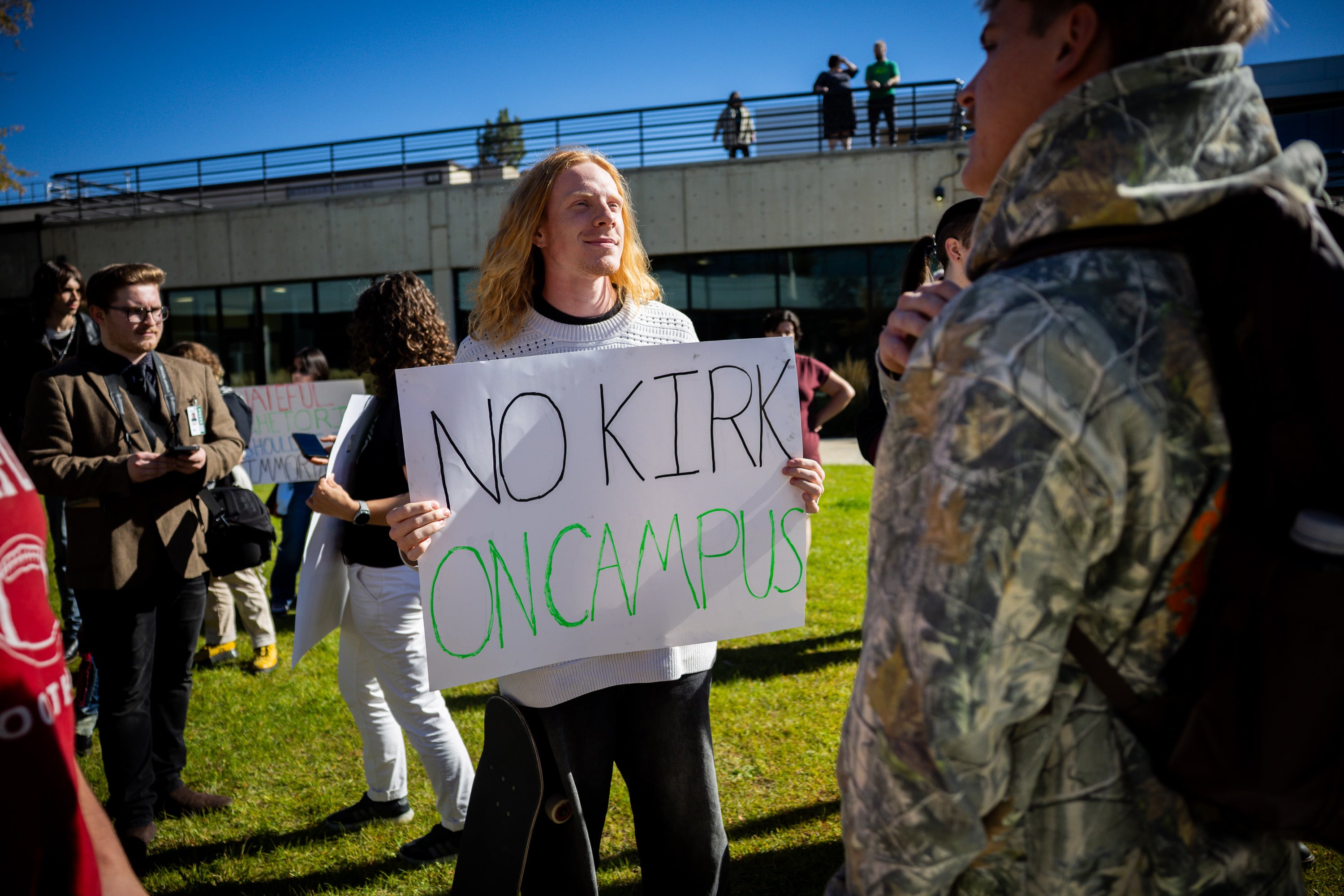 Tyler Erickson, UVU student debates with Alexander Draper, UVU student, as Draper protests at Utah Valley University's courtyard in Orem on Oct. 21, against putting up a memorial to honor Charlie Kirk. UVU received an "F" from the Foundation for Individual Rights and Expression for free speech on campus.