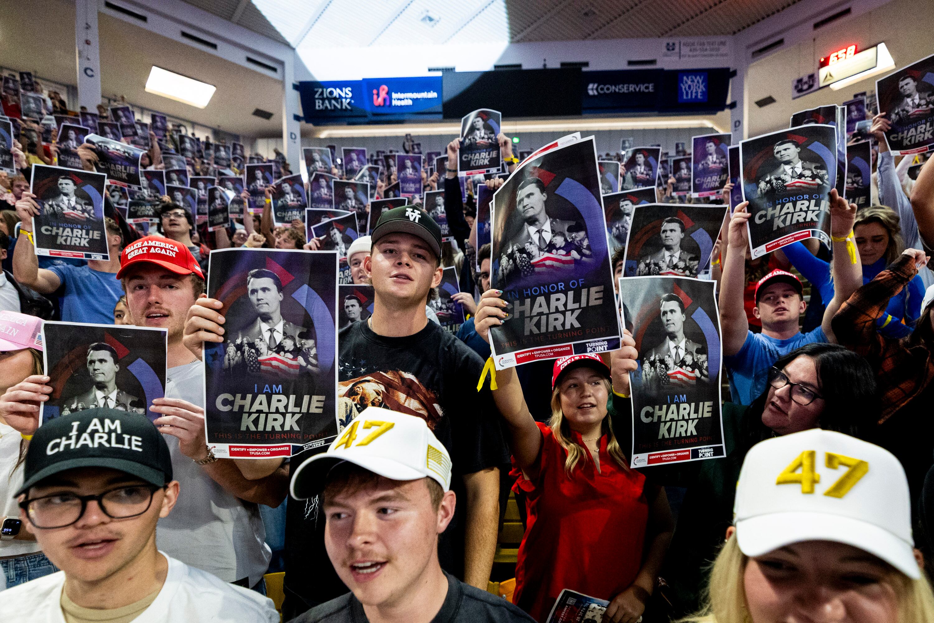 Attendees hold up posters of Charlie Kirk during a stop on the “This Is The Turning Point” tour held by Turning Point USA at the Dee Glen Smith Spectrum on the campus of Utah State University in Logan on Sept. 30, 2025. The school received a "D" from FIRE for free speech on campus.