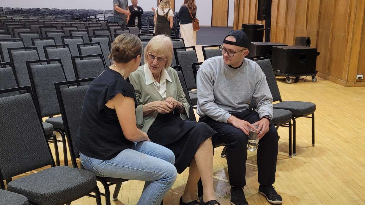 Sora Vigorito speaks to two attendees following her speech at the Student Union at the University of Utah on Tuesday evening.