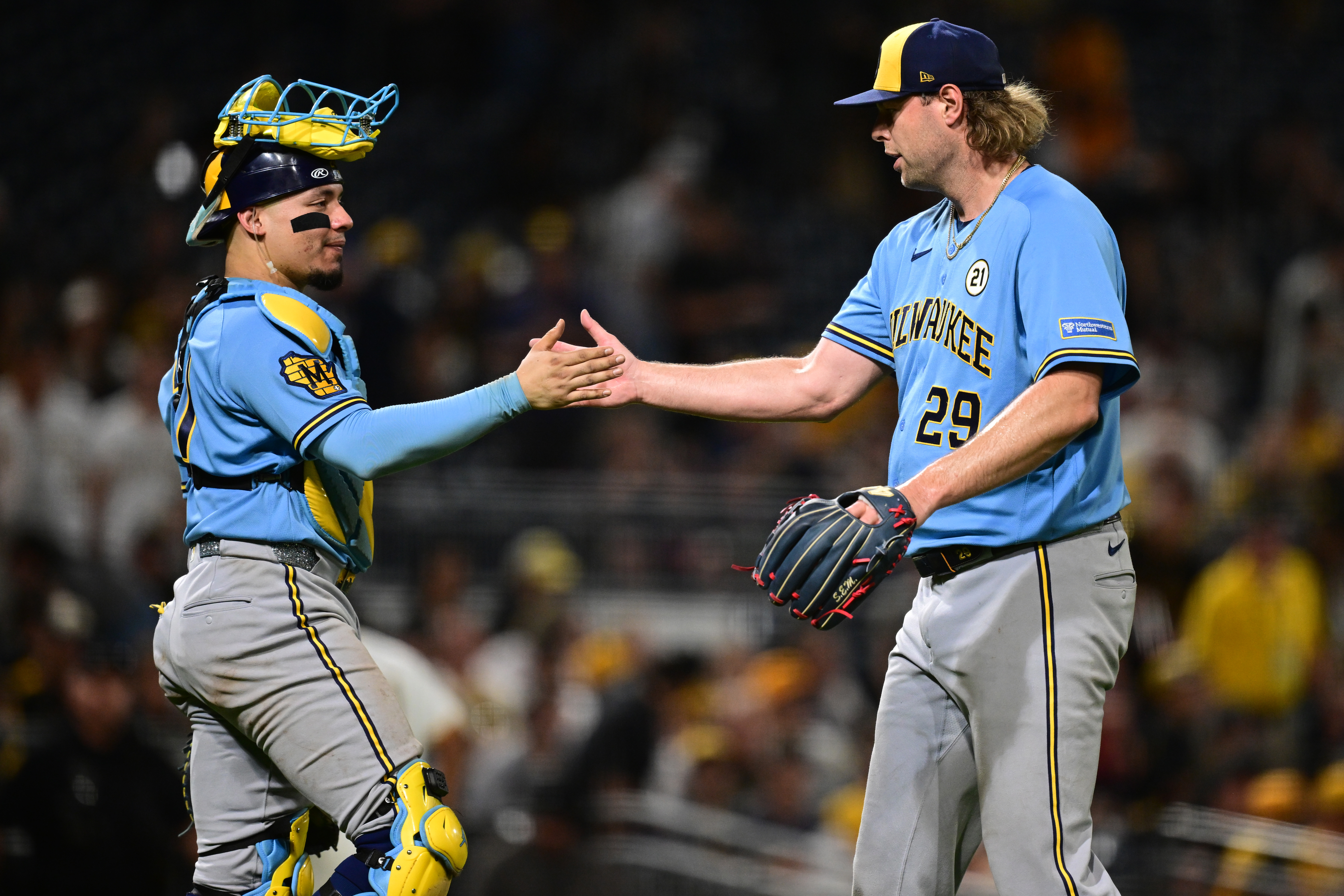 Milwaukee Brewers pitcher Trevor Megill is congratulated by catcher William Contreras after the Brewers defeated the Pittsburgh Pirates in a baseball game, Tuesday, Sept. 15, 2026, in Pittsburgh. 