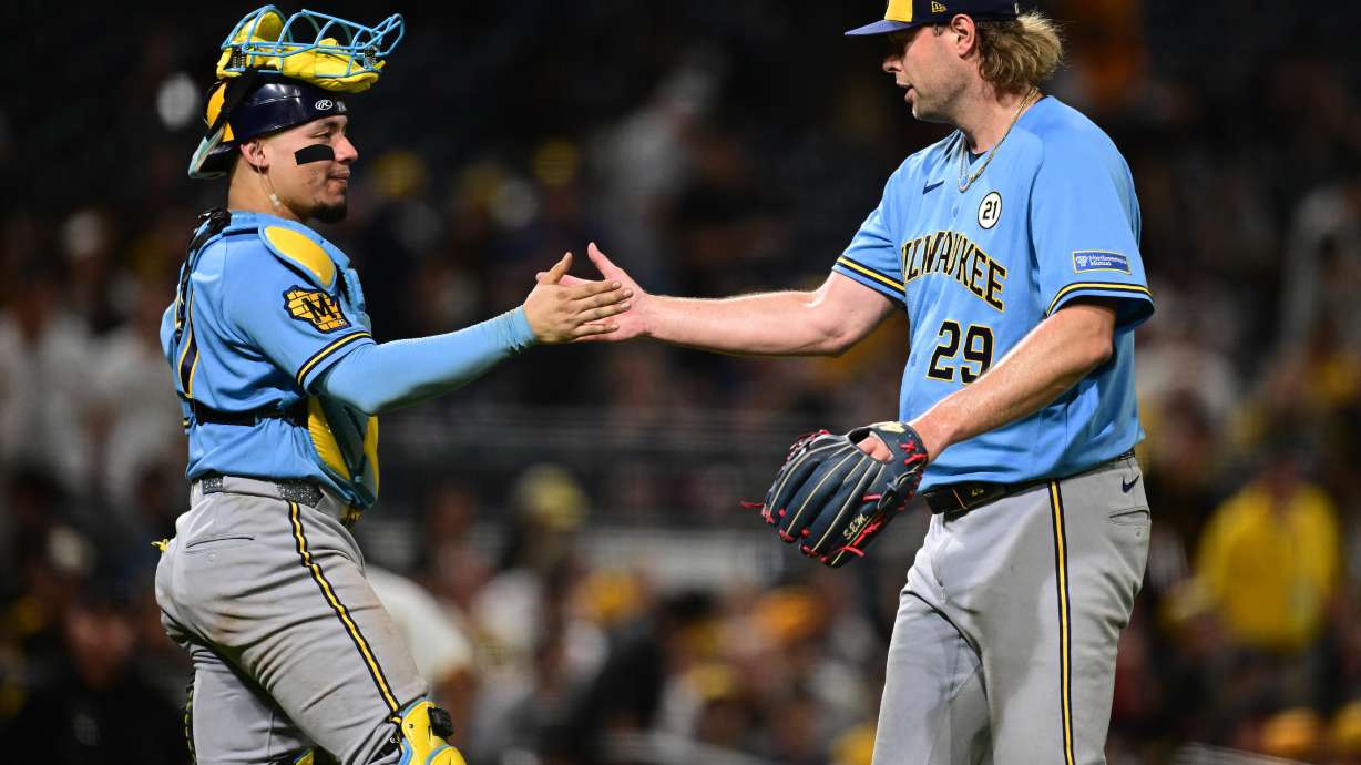 Milwaukee Brewers pitcher Trevor Megill is congratulated by catcher William Contreras after the Brewers defeated the Pittsburgh Pirates in a baseball game, Tuesday, Sept. 15, 2026, in Pittsburgh.