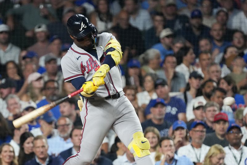 Sep 15, 2026; Chicago, Illinois, USA;  Atlanta Braves designated hitter Ronald Acuna Jr. (13) hits a two-run home run against the Chicago Cubs during the sixth inning at Wrigley Field.