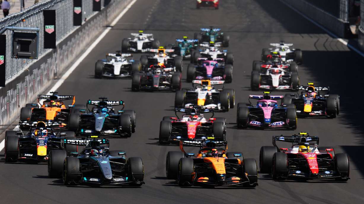 McLaren driver Lando Norris of Britain, center, leads the field after the start of the Spanish Formula One Grand Prix race in Madrid, Sunday, Sept. 13, 2026.