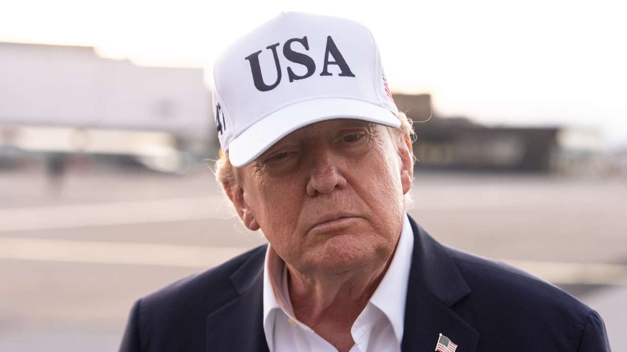 President Donald Trump speaks with reporters before boarding Air Force One at Shannon Airport, on Sunday, in Shannon, Ireland.