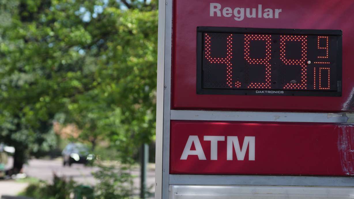 The per-gallon price for regular unleaded fuel is displayed electronically on a sign outside a Conoco gasoline station Sept. 9, in Denver. Consumers might gripe about high prices, especially for gas, but a new report says they're still spending.