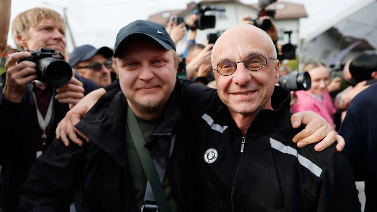 Dzmitry Navazhylau, one of the released Belarusian prisoners, is welcomed by his colleagues upon his arrival in Vilnius, Lithuania, Wednesday. Belarus released 25 prisoners in exchange for U.S. sanctions relief.