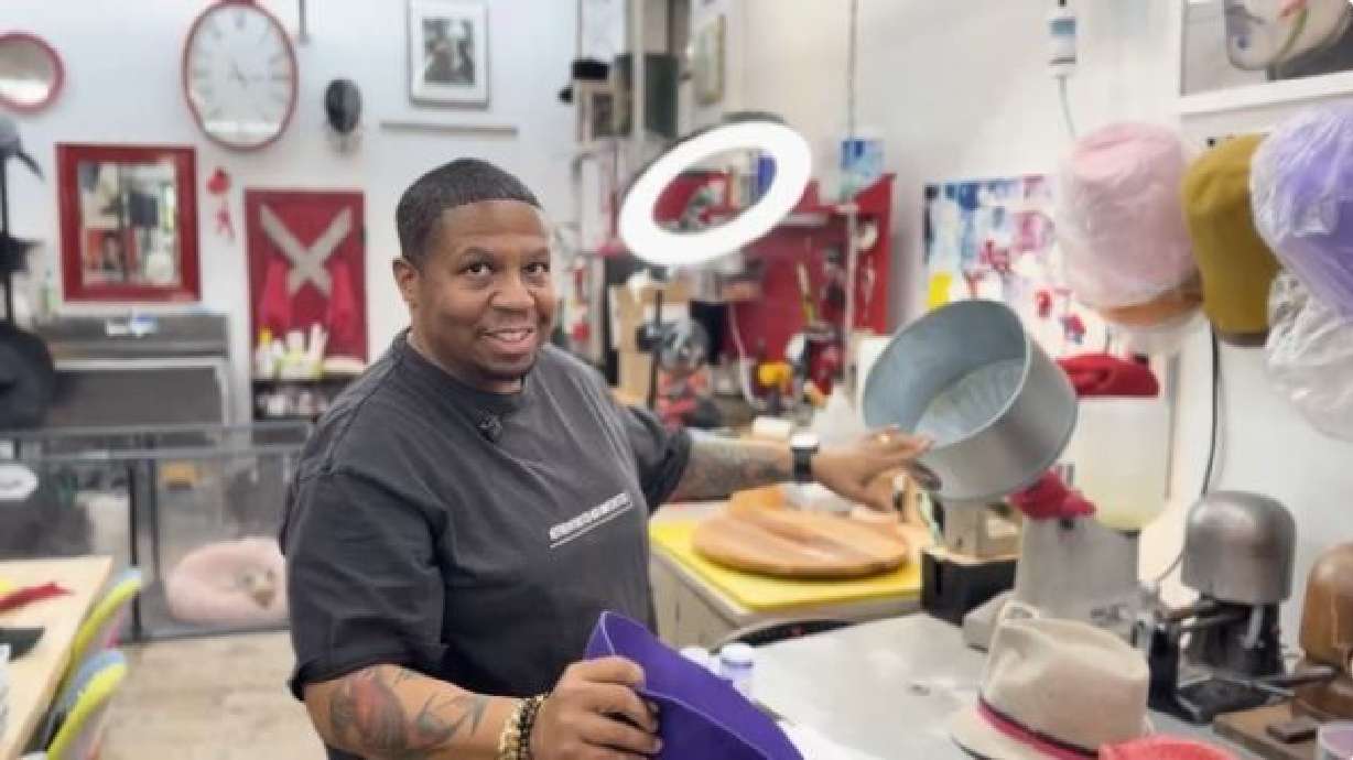 Inside his College Park studio, Otis Damón gently wets and steams a piece of fabric known in the trade as a "hood," preparing to shape it over a wooden block.