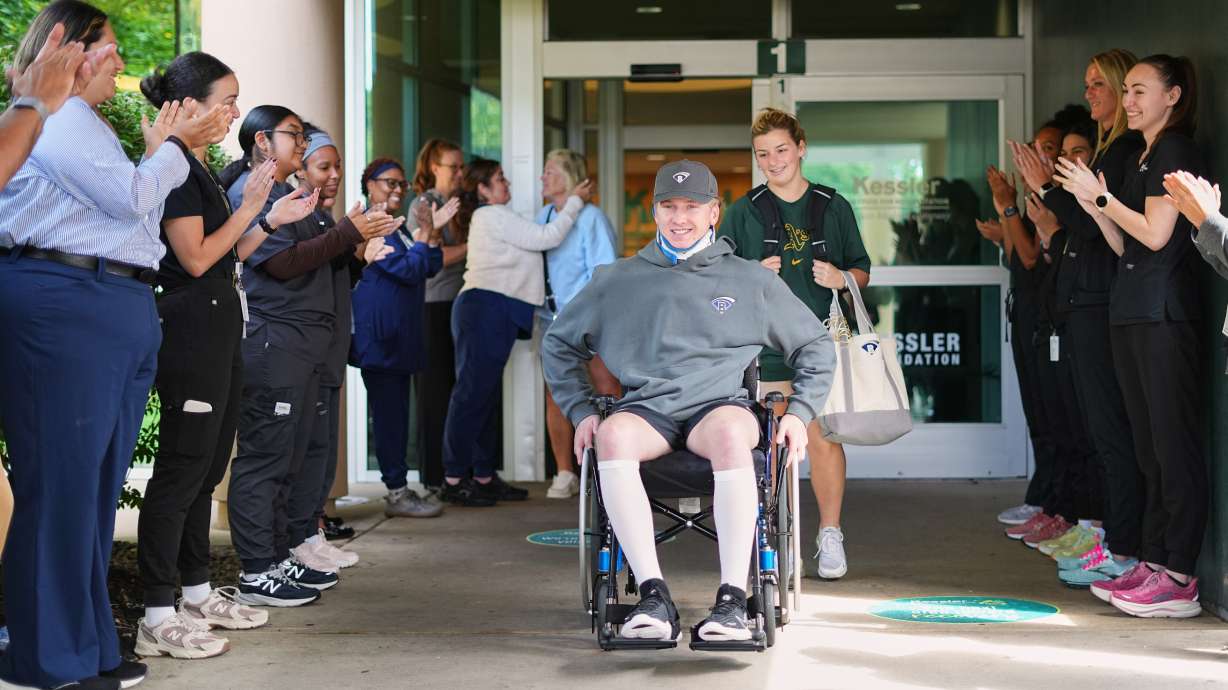 Caregivers clap out Ryan Lasko, a minor league prospect with the Athletics who was paralyzed in an outfield collision more than two months ago, upon his discharge from Kessler Institute for Rehabilitation in West Orange, N.J., Wednesday, Sept. 16, 2026.