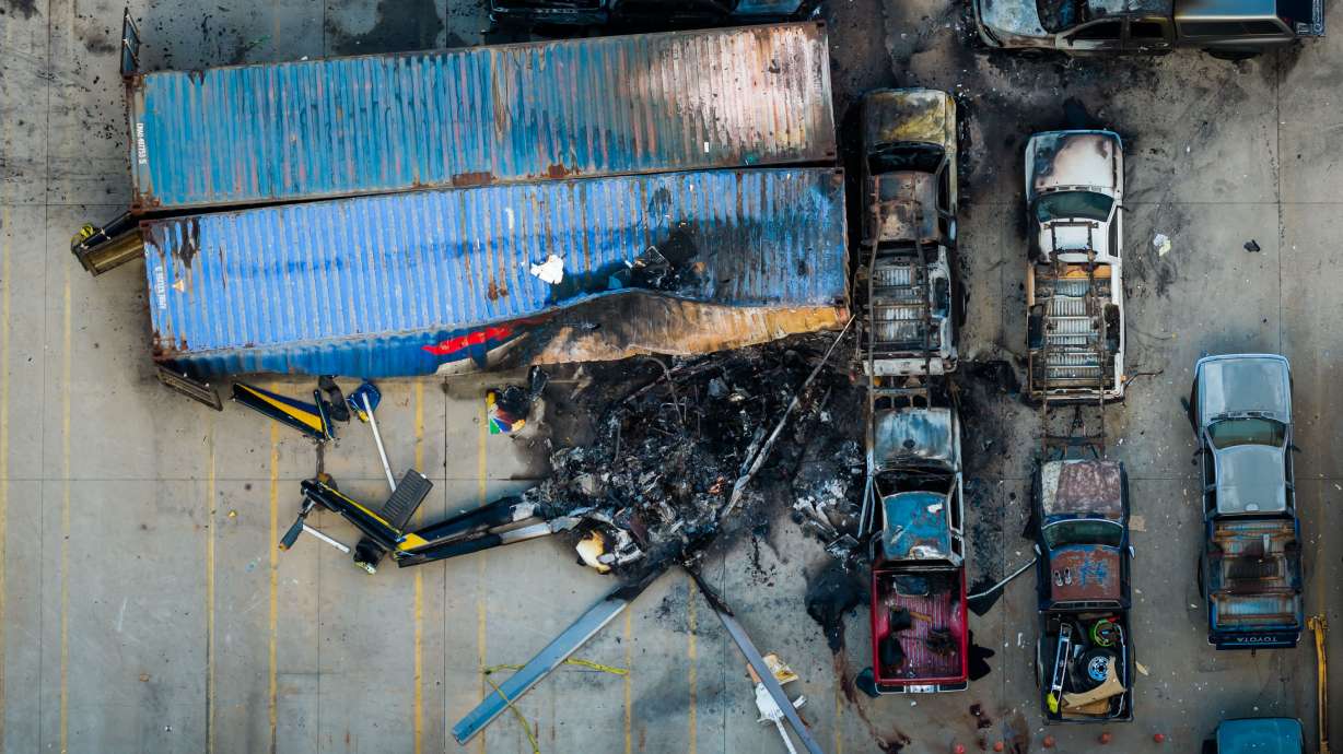 An aerial view of the aftermath of a news helicopter that crashed in Chatsworth, a neighborhood in Los Angeles, Wednesday. A motorist was arrested for investigation of murder in a collision that occurred prior to the helicopter crash.