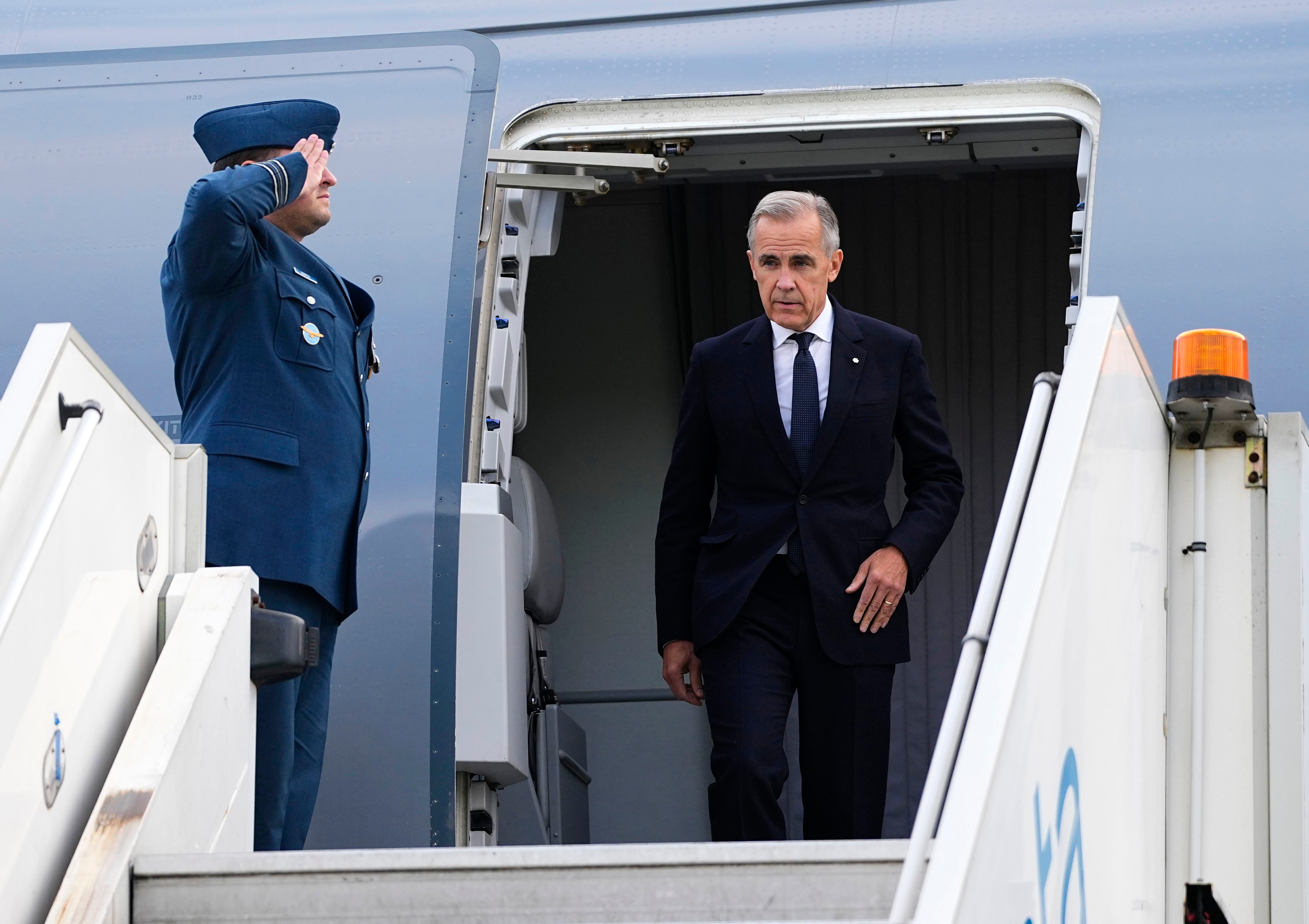 Canada's Prime Minister Mark Carney arrives in Manchester, England, Wednesday, Sept. 16, 2026, heading for Liverpool where he will meet with Britain's Prime Minister Andy Burnham. 