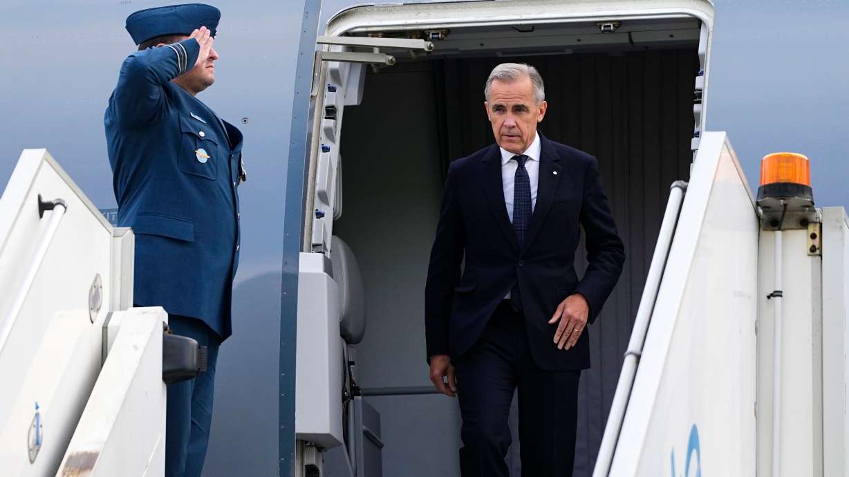 Canada's Prime Minister Mark Carney arrives in Manchester, England, Wednesday, Sept. 16, 2026, heading for Liverpool where he will meet with Britain's Prime Minister Andy Burnham.