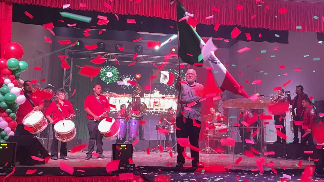 Utah's Mexican community marked Mexican Independence Day at the Mexican Civic Center in Salt Lake City on Tuesday. Antonio Cruz Dias, acting general consul of the Mexican Consulate in Utah, waves a Mexican flag at the event.