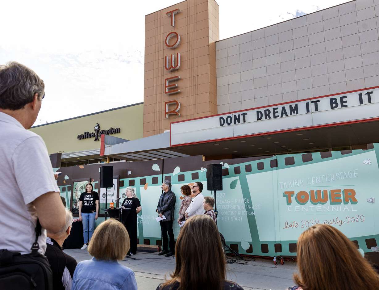 People gather outside the Tower Theatre during announcements about the theater project’s update in Salt Lake City on Wednesday. The project is expected to begin in earnest next year, before reopening in 2028 — the centennial year for the building.