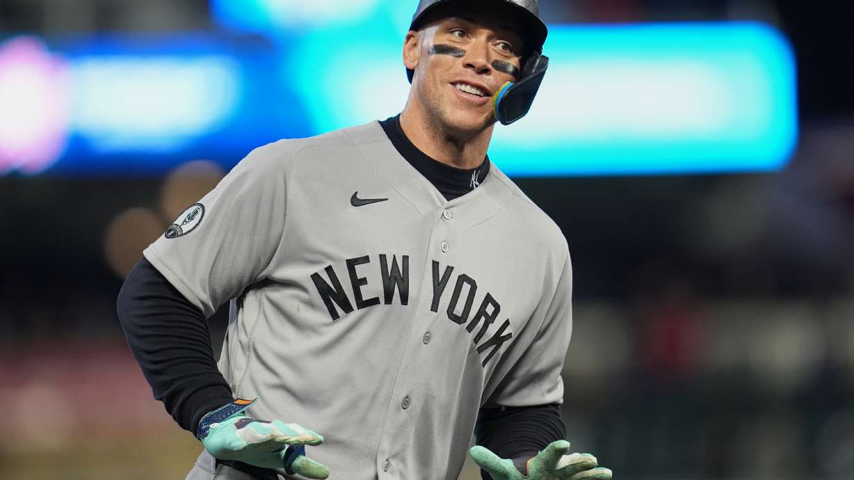 New York Yankees' Aaron Judge celebrates while running the bases after hitting a three-run home run during the eighth inning of a baseball game against the Minnesota Twins, Monday, Sept. 14, 2026, in Minneapolis.