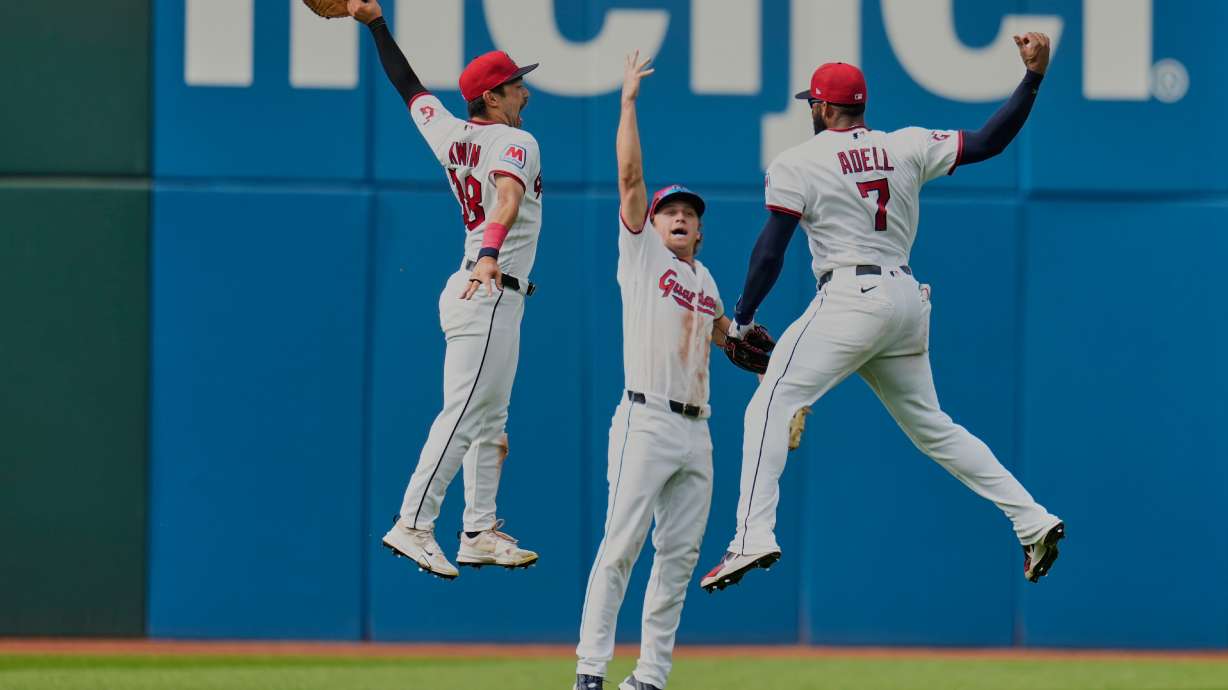 Cleveland Guardians left fielder Steven Kwan, left, center fielder Petey Halpin, center, and right fielder Jo Adell (7) celebrate after the Guardians defeated the Chicago White Sox in a baseball game in Cleveland, Wednesday, Sept. 16, 2026.