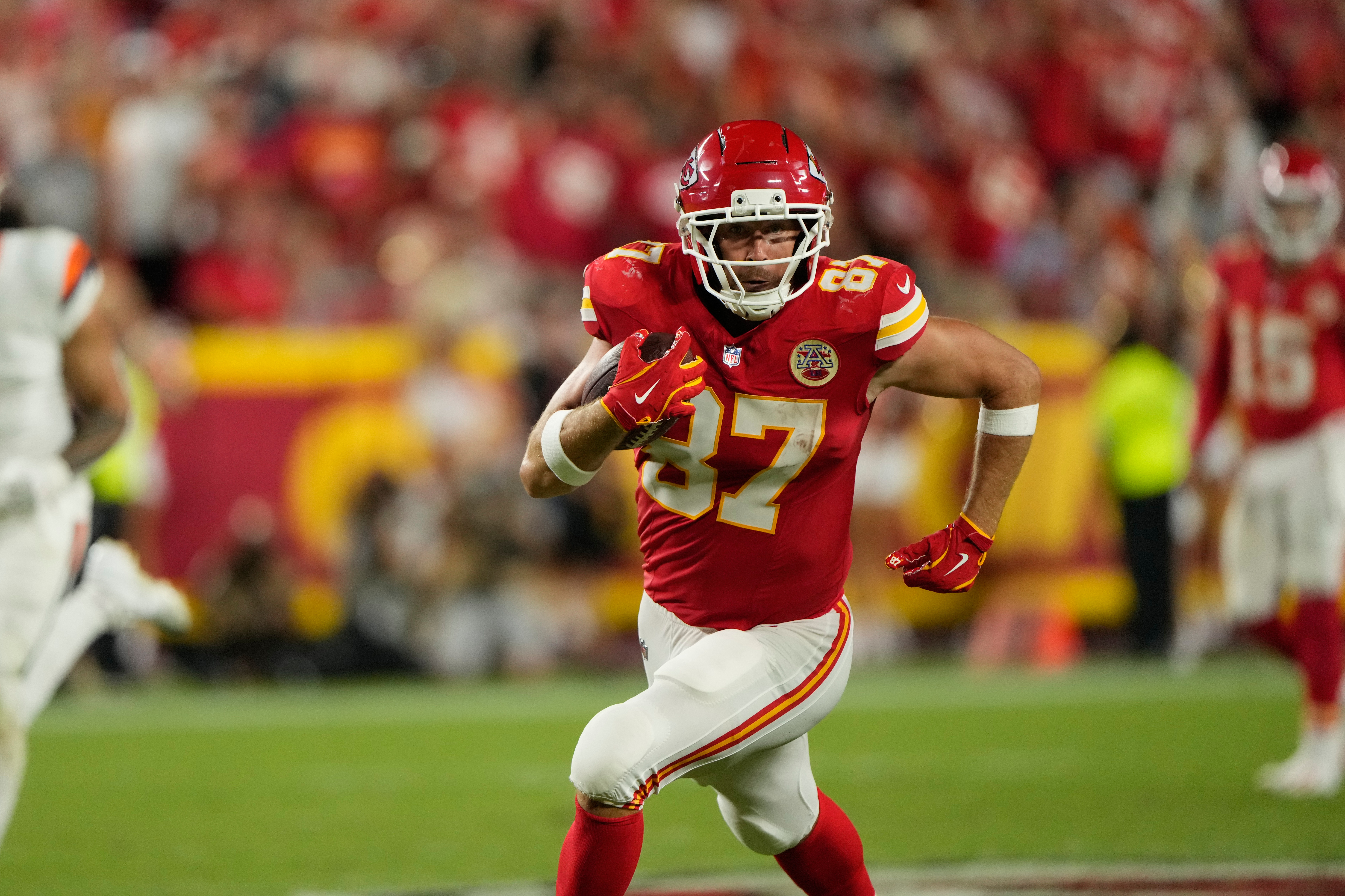 Kansas City Chiefs tight end Travis Kelce runs the ball after making a catch against the Denver Broncos during the second half of an NFL football game Monday, Sept. 14, 2026, in Kansas City, Mo. 