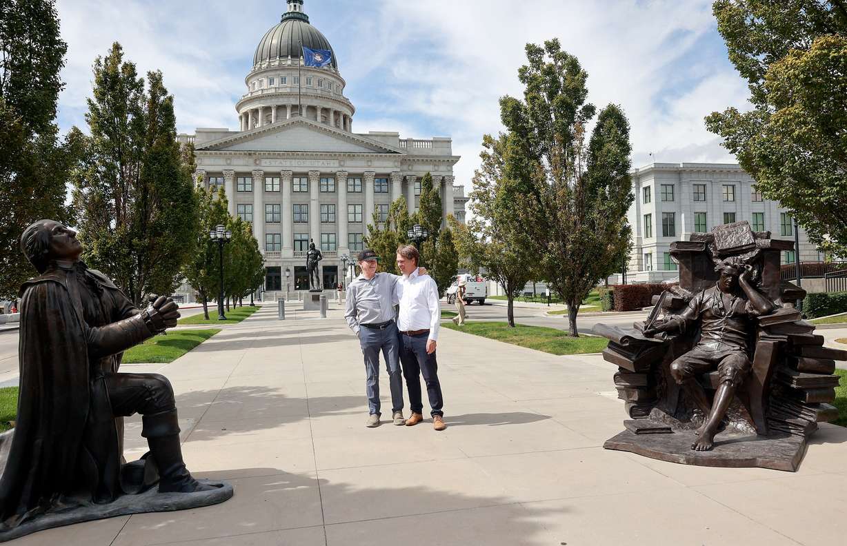 Steven Neal and Michael Hall pose for photos between their sculptures of George Washington and Thomas Jefferson outside the Capitol in Salt Lake City on Wednesday.