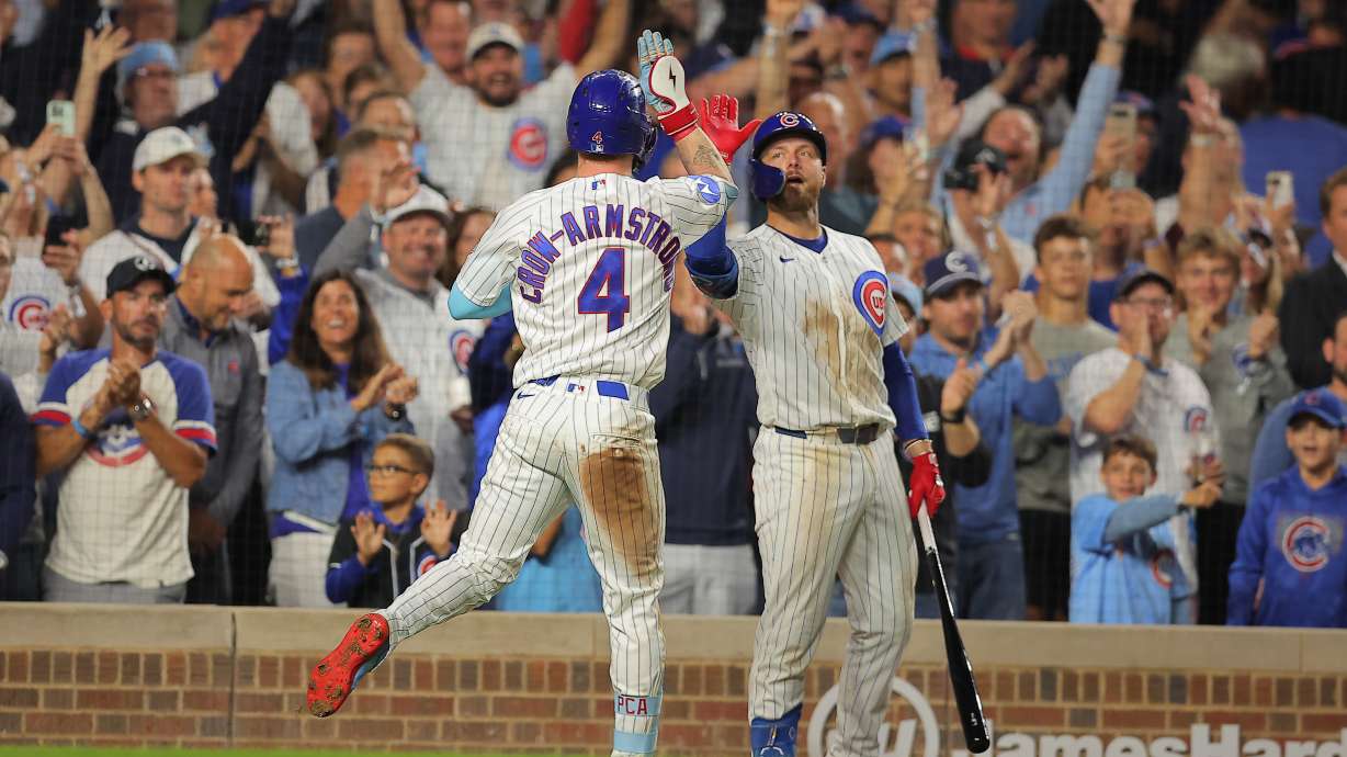 Chicago Cubs' Pete Crow-Armstrong, left, celebrates his home run with teammate Michael Busch, right, during the seventh inning of a baseball game against the Atlanta Braves, Wednesday, Sept. 16, 2026, in Chicago.