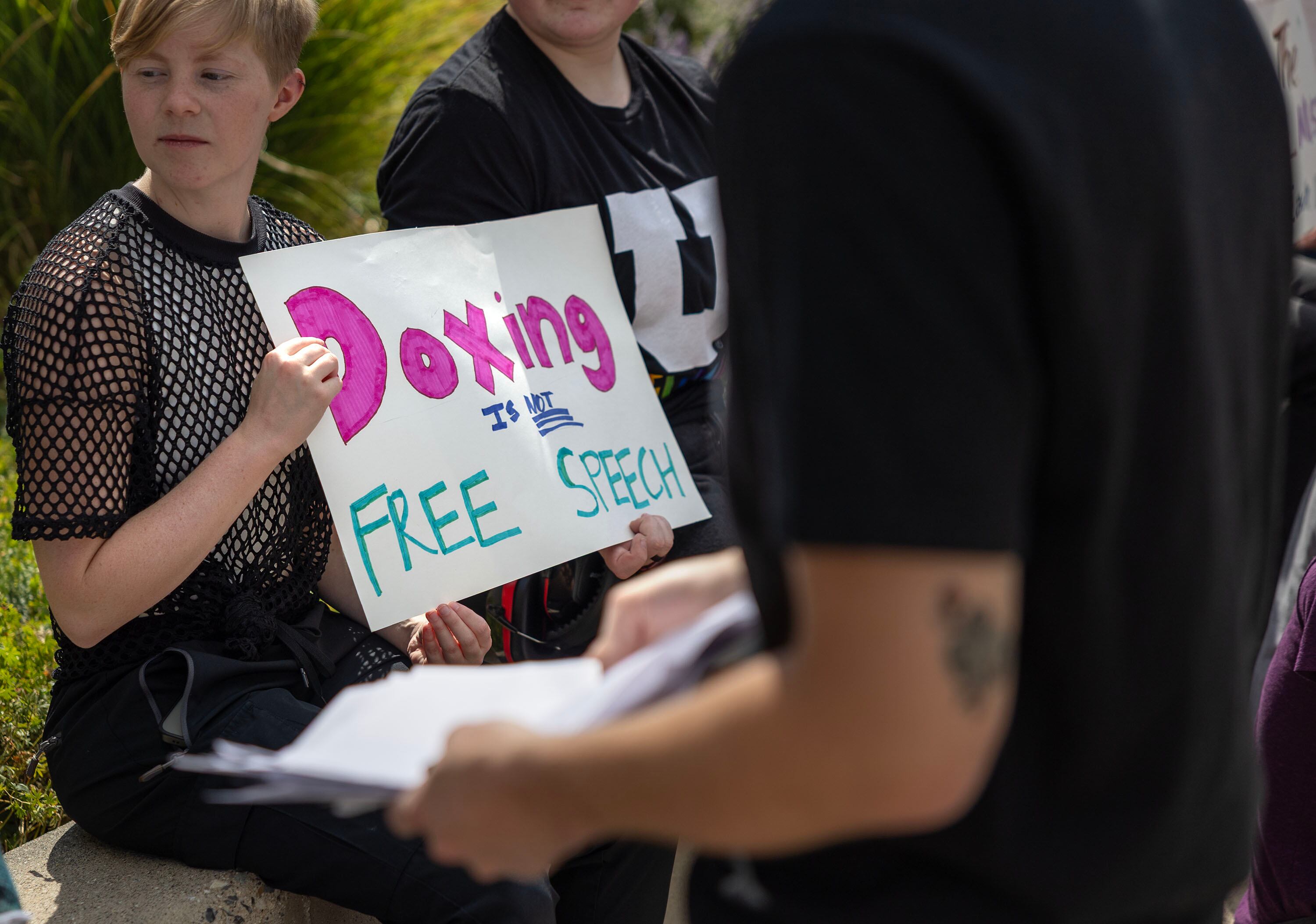 A group of University of Utah students write letters to the university’s dean of college affairs at the campus in Salt Lake City on Wednesday. The students say members of the College Republicans should be held accountable for posting a photo of a student that was later doxxed who approached them with a cake featuring a joke about Charlie Kirk's murder.
