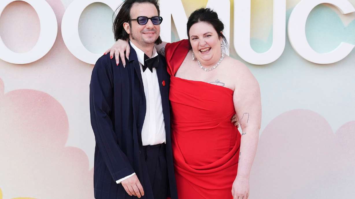 Lena Dunham, pictured in June 2025 with her husband Luis Felber, says the couple has welcomed a baby via surrogacy.