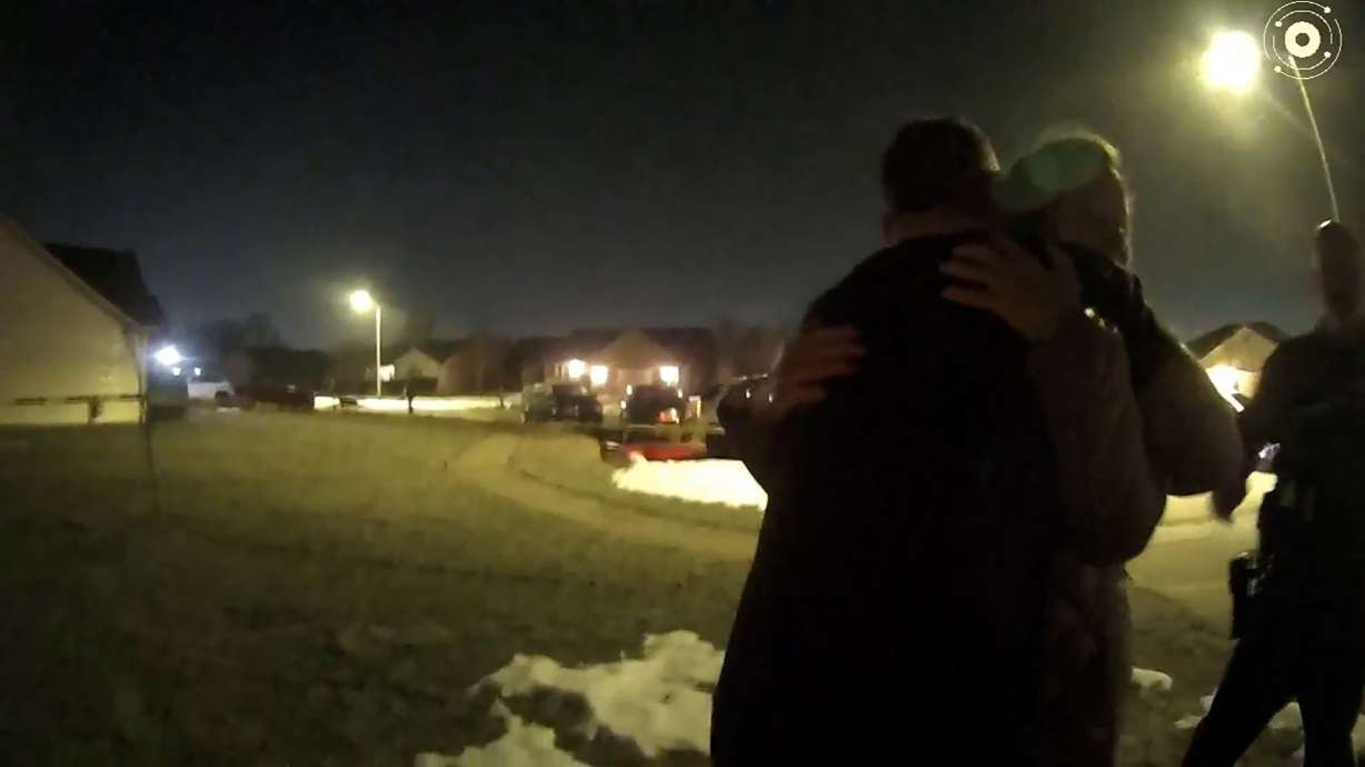 Caleb Flynn embraces his mother-in-law as law enforcement investigate the killing of his wife in February 2026.