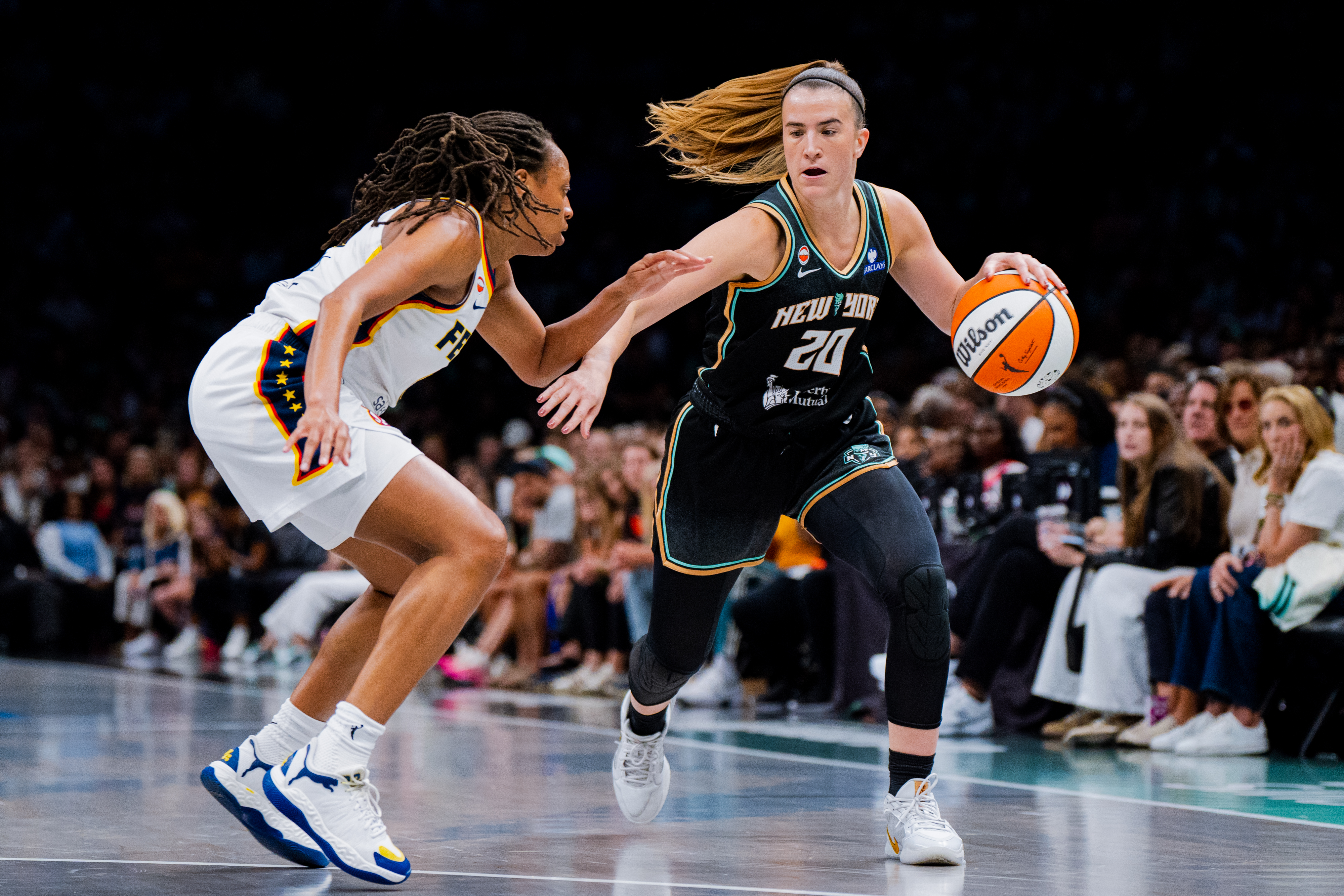 New York Liberty guard Sabrina Ionescu (20) dribbles toward the basket during the first half of a WNBA basketball game against the Indiana Fever, Saturday, Aug. 22, 2026, in New York. 