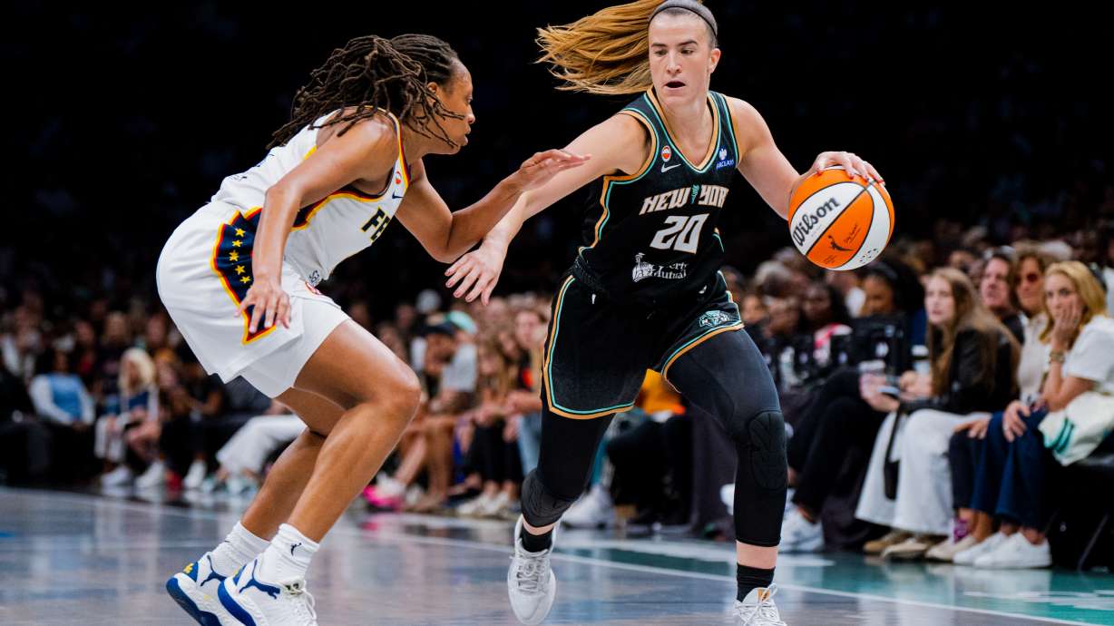 New York Liberty guard Sabrina Ionescu (20) dribbles toward the basket during the first half of a WNBA basketball game against the Indiana Fever, Saturday, Aug. 22, 2026, in New York.
