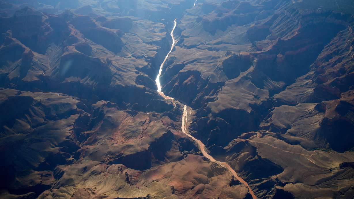 Bright Angel Canyon, the scene of flash floods, meets with the Colorado River in the Grand Canyon, Aug. 31, at Grand Canyon National Park, Ariz. Timothy Allen Smith was officially identified as the last missing person on Thursday after last month's flooding.