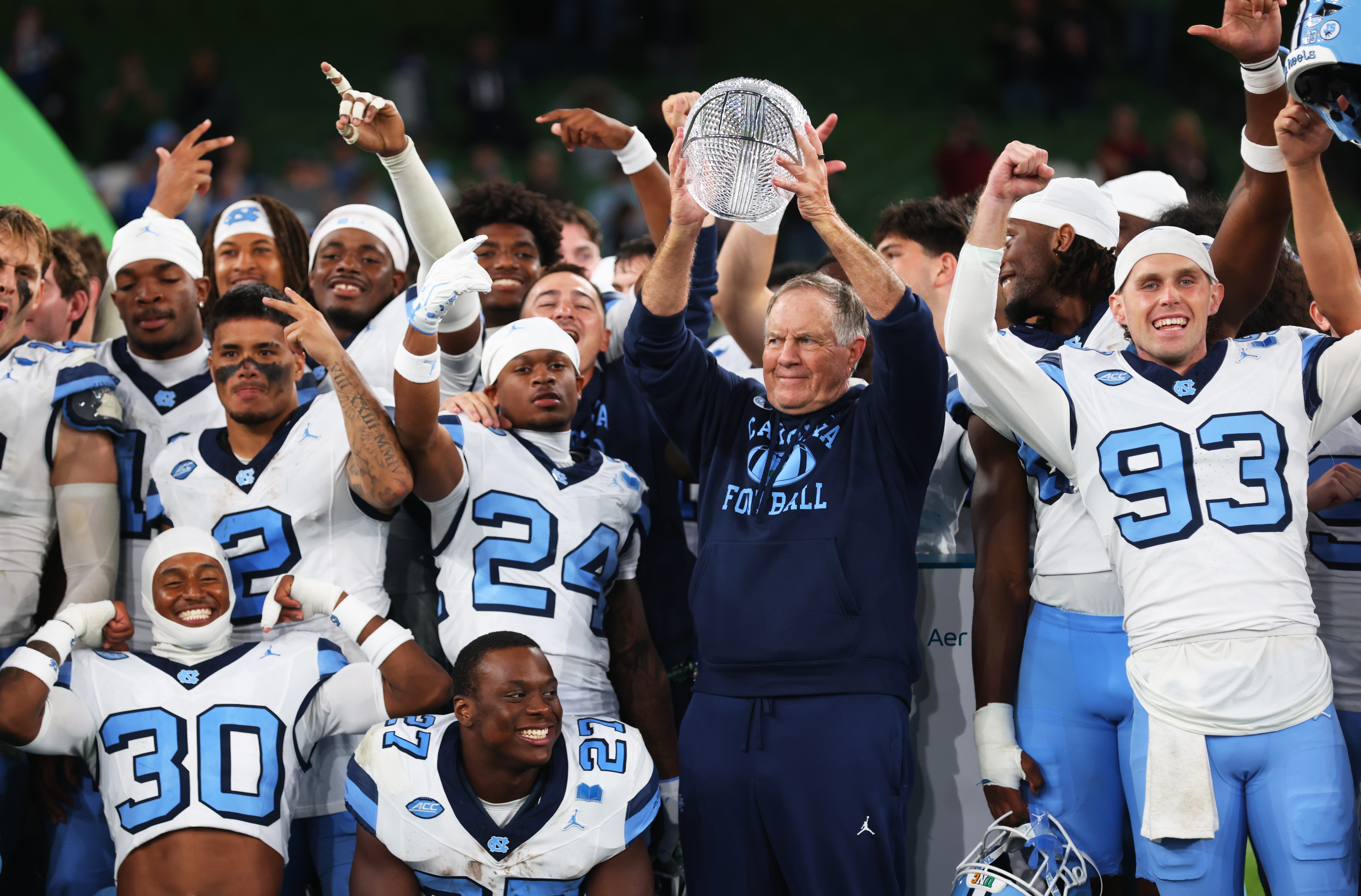 North Carolina head coach Bill Belichick, center right, and his team celebrate after defeating TCU in an NCAA college football game in Dublin, Ireland, Saturday, Aug. 29, 2026. 