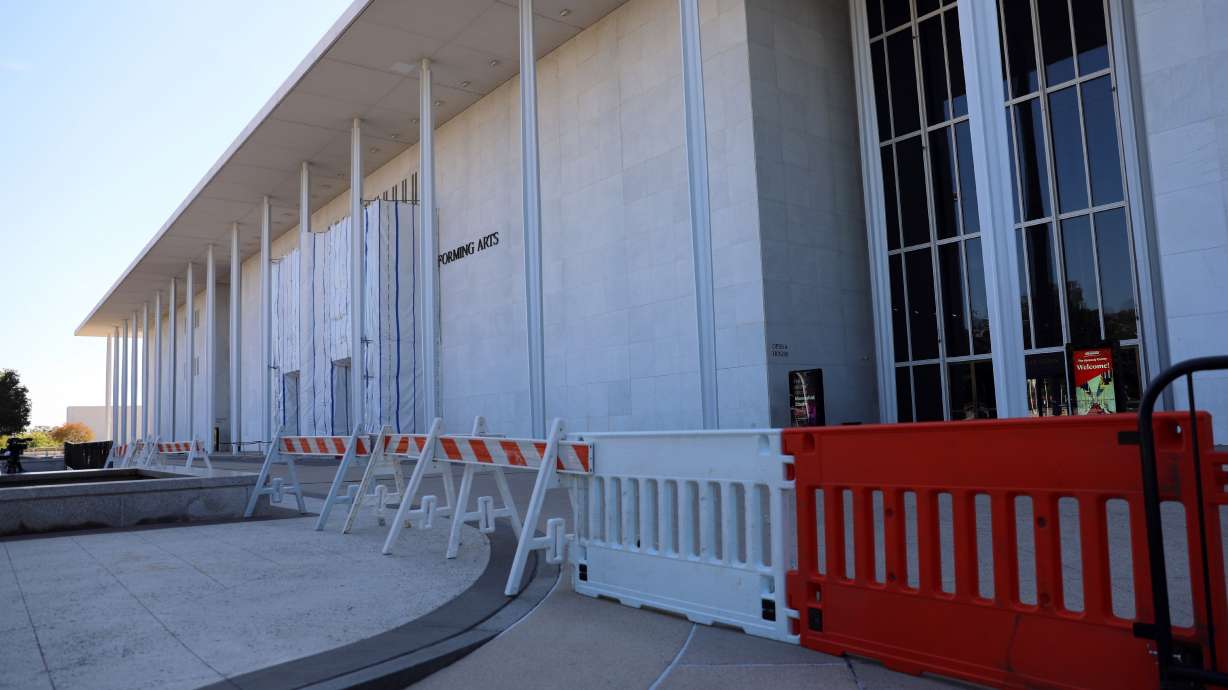 Barricades are installed in front of the John F. Kennedy Center for the Performing Arts, Wednesday, in Washington. An official said he closed the building temporarily due to "acute risks to public safety resulting from continued structural deterioration."