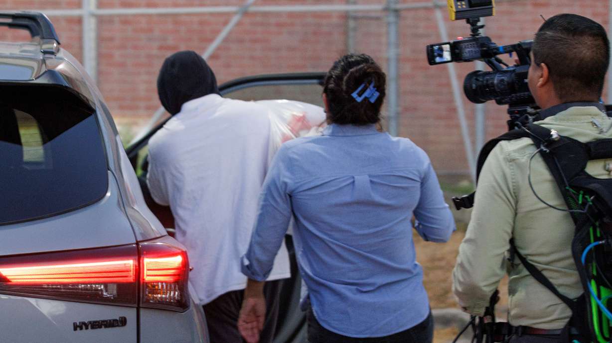 Immigration and Customs Enforcement officer Christian Castro gets into a car after being released from the Carrizalez-Rucker Cameron County Detention Center in Brownsville, Texas, on Aug. 27. Castro, charged with shooting a Venezuelan man last winter and lying about the circumstances, had his bail set on Thursday.
