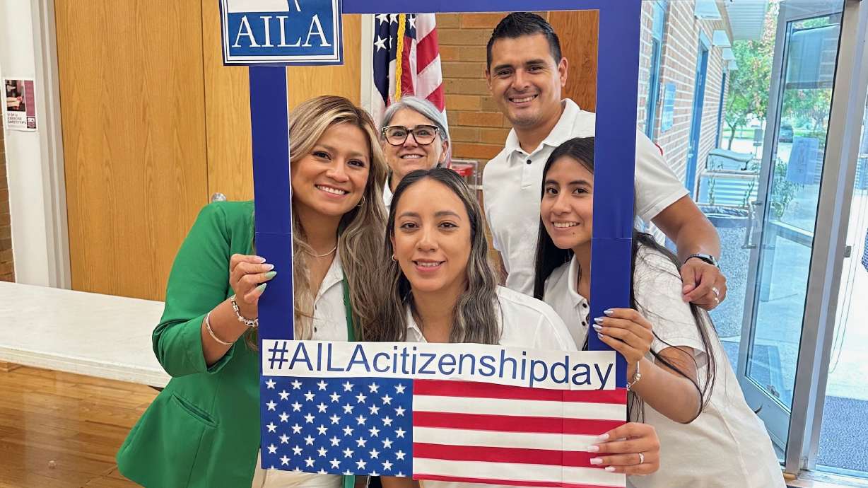 Immigration attorney Ysabel Lonazco, left, with others at an event to help aid immigrants pursuing U.S. citizenship on Sept. 20, 2025.