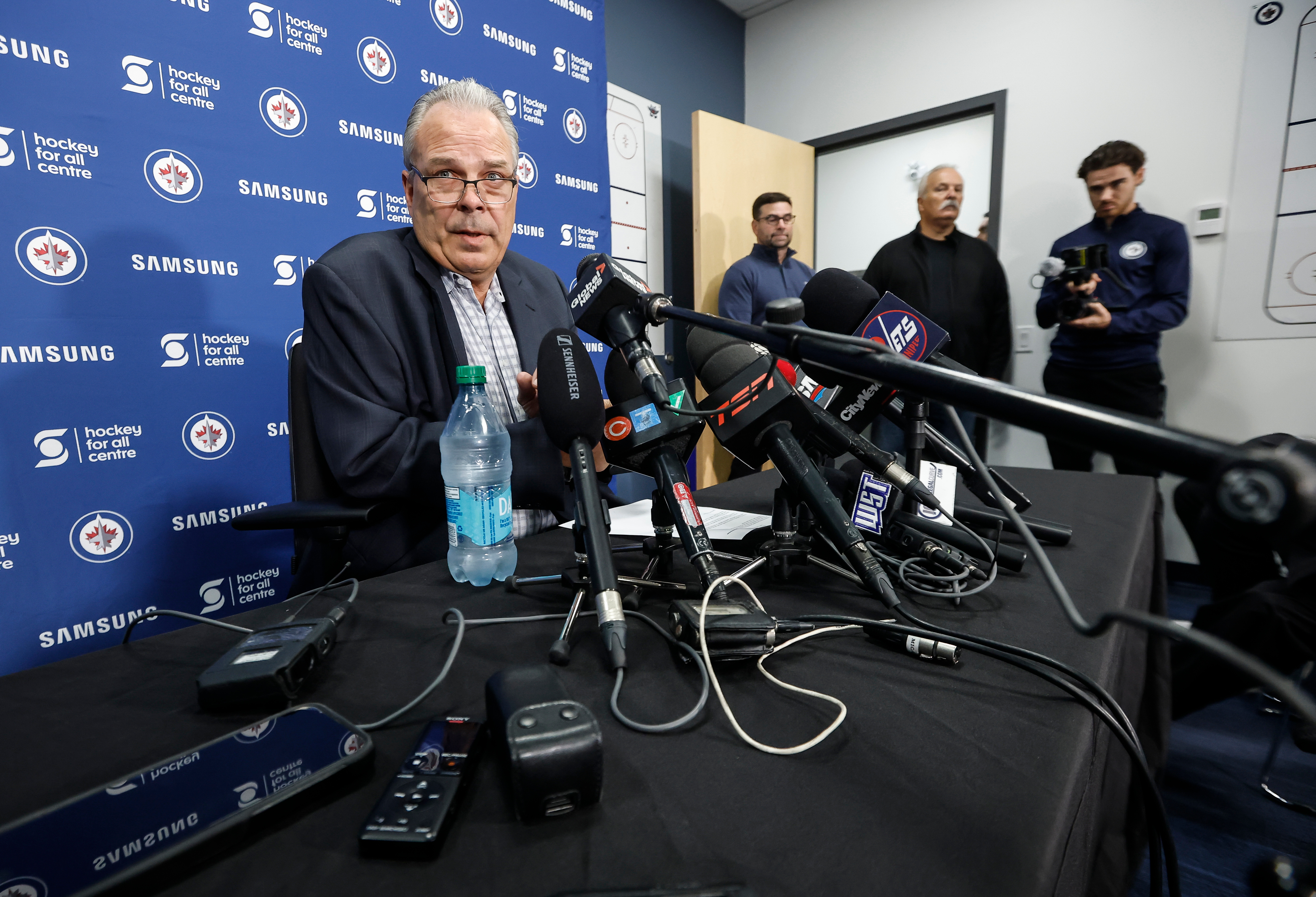 Winnipeg Jets general manager Kevin Cheveldayoff talks to media regarding the suspension of Connor Hellebuyck during the NHL hockey team's training camp in Winnipeg, Manitoba, Thursday, Sept. 17, 2026. 