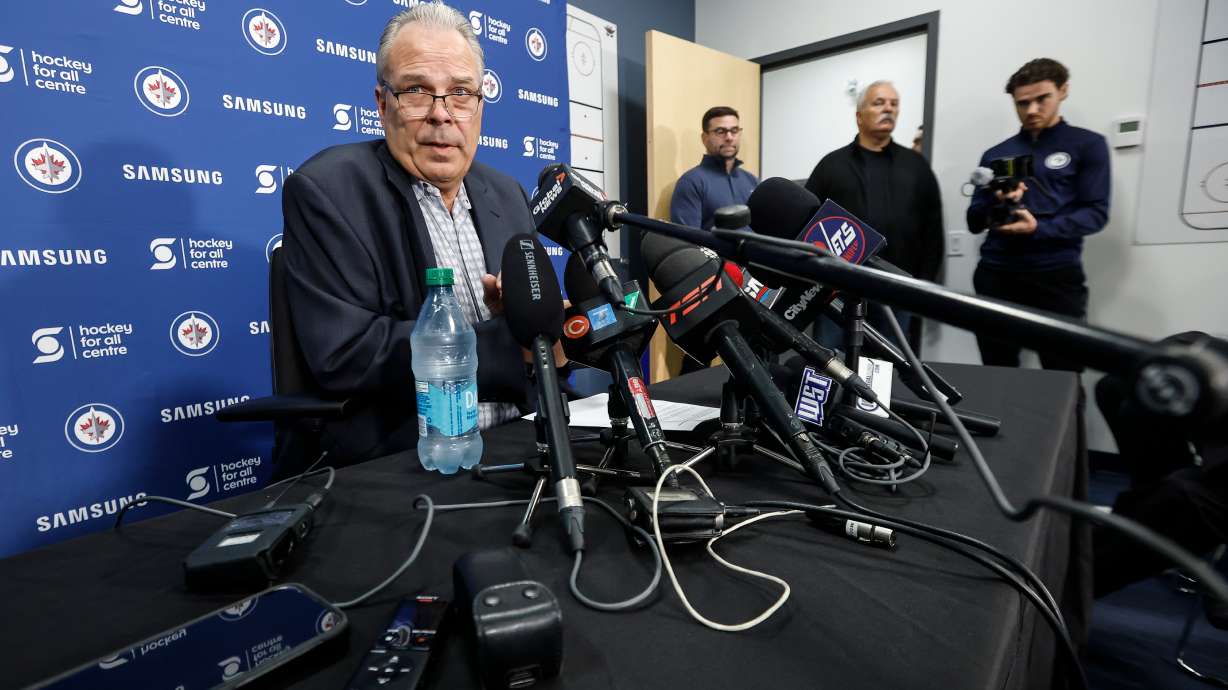 Winnipeg Jets general manager Kevin Cheveldayoff talks to media regarding the suspension of Connor Hellebuyck during the NHL hockey team's training camp in Winnipeg, Manitoba, Thursday, Sept. 17, 2026.