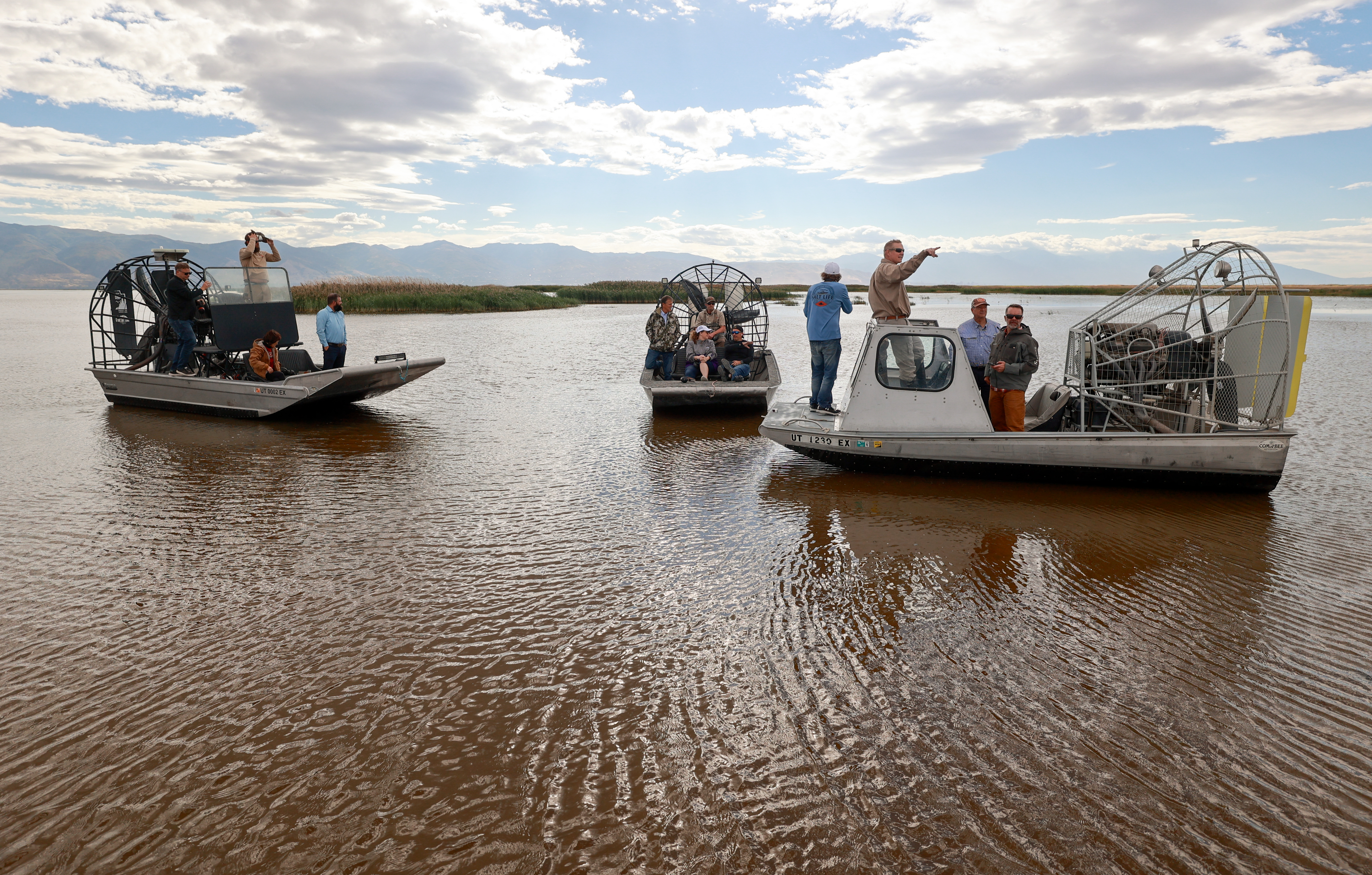 Utah state senators and other interested parties pause during an airboat ride through Farmington Bay on the eastern side of the Great Salt Lake on Thursday.