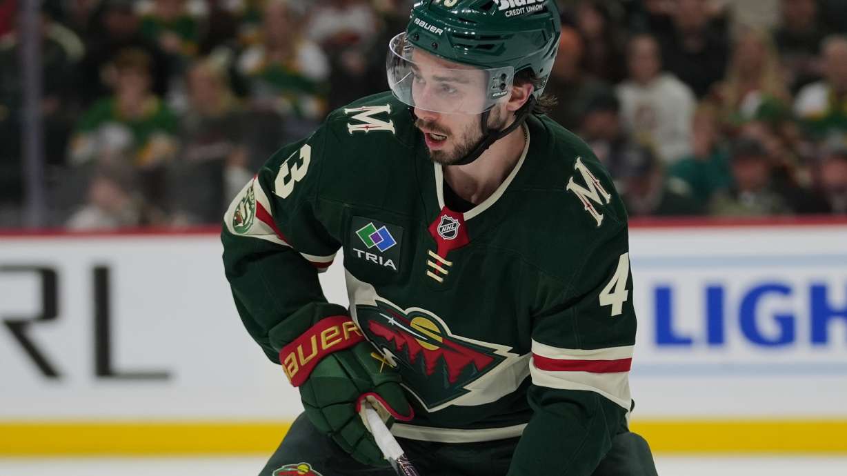 FILE - Minnesota Wild defenseman Quinn Hughes (43) skates with the puck during the second period of Game 3 of an NHL Stanley Cup hockey second-round playoff series against the Colorado Avalanche Saturday, May 9, 2026, in St. Paul, Minn.