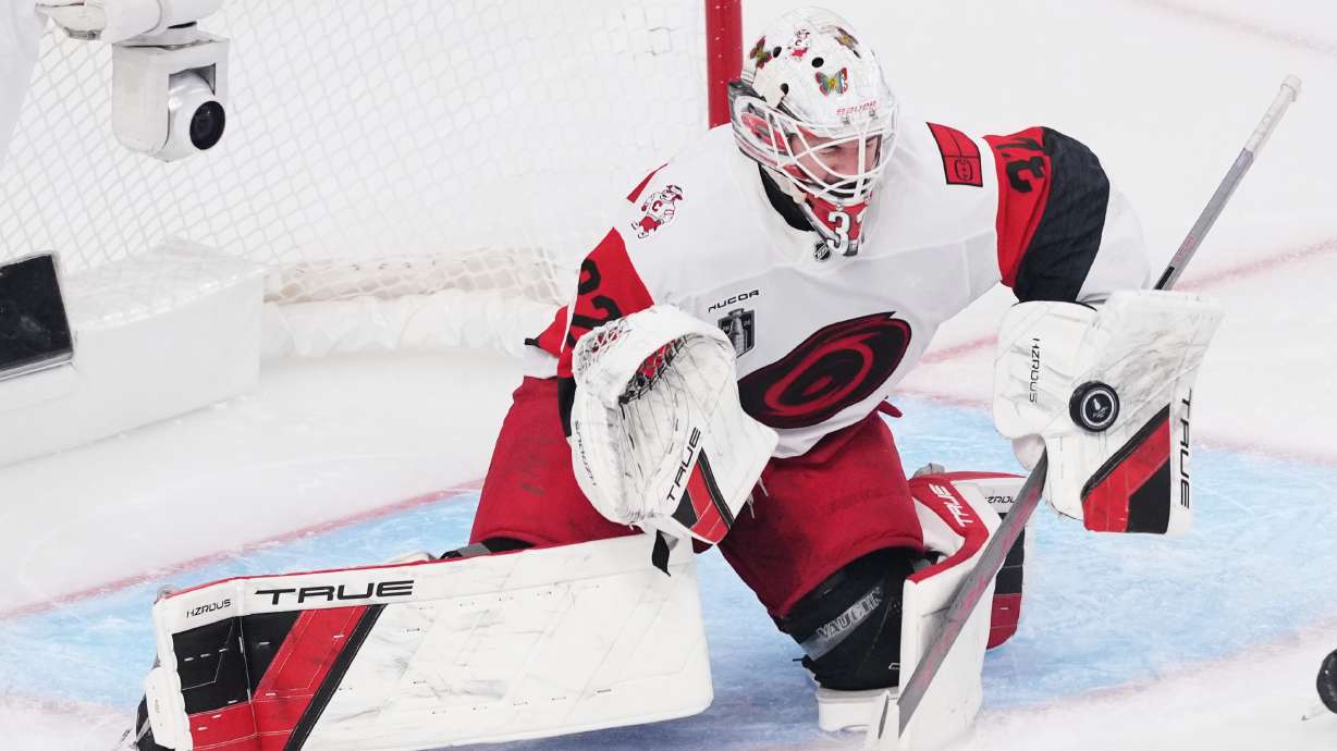 FILE - Carolina Hurricanes goaltender Brandon Bussi (32) stops a shot on goal during the second period in Game 6 of the NHL hockey Stanley Cup Final series against the Vegas Golden Knights, Sunday, June 14, 2026, in Las Vegas.