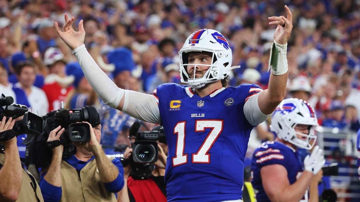 Buffalo Bills quarterback Josh Allen (17) celebrates his rushing touchdown against the Detroit Lions during the second half of an NFL football game in Orchard Park, N.Y., Thursday, Sept. 17, 2026.